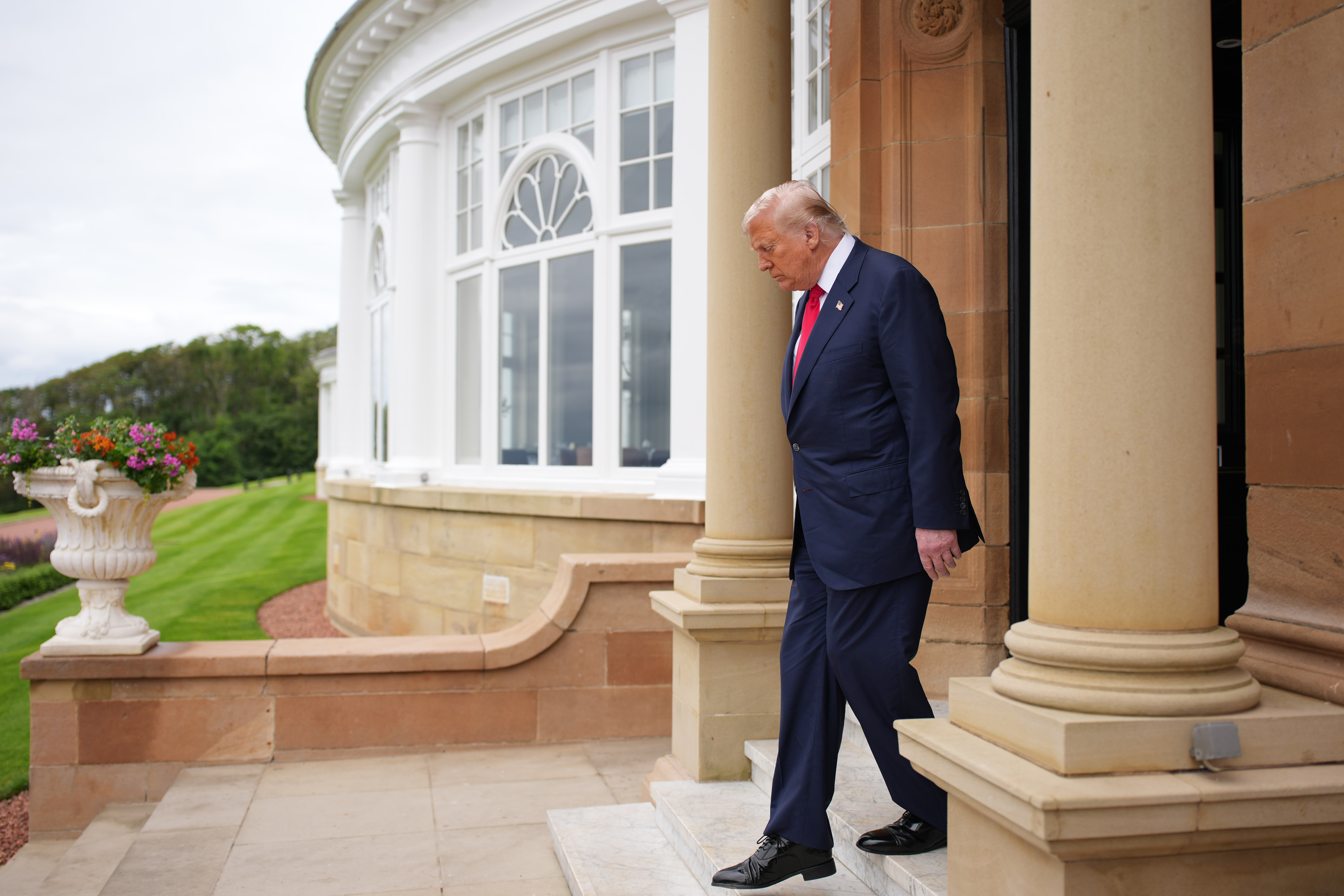 Donald Trump prepares to greet British Prime Minister Keir Starmer and his wife Victoria Starmer at Trump Turnberry golf club on July 28, 2025 in Scotland | Source: Getty Images