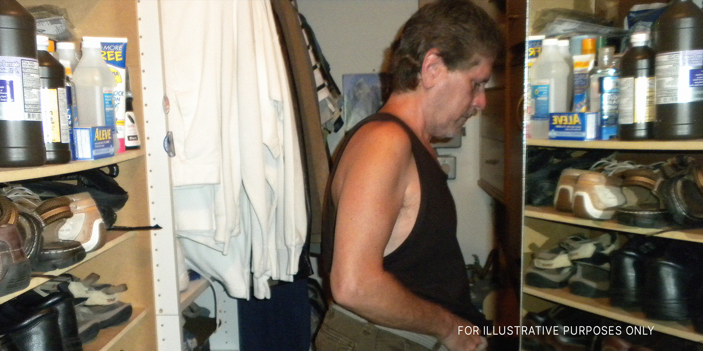 A man dressing in a closet | Source: Flickr