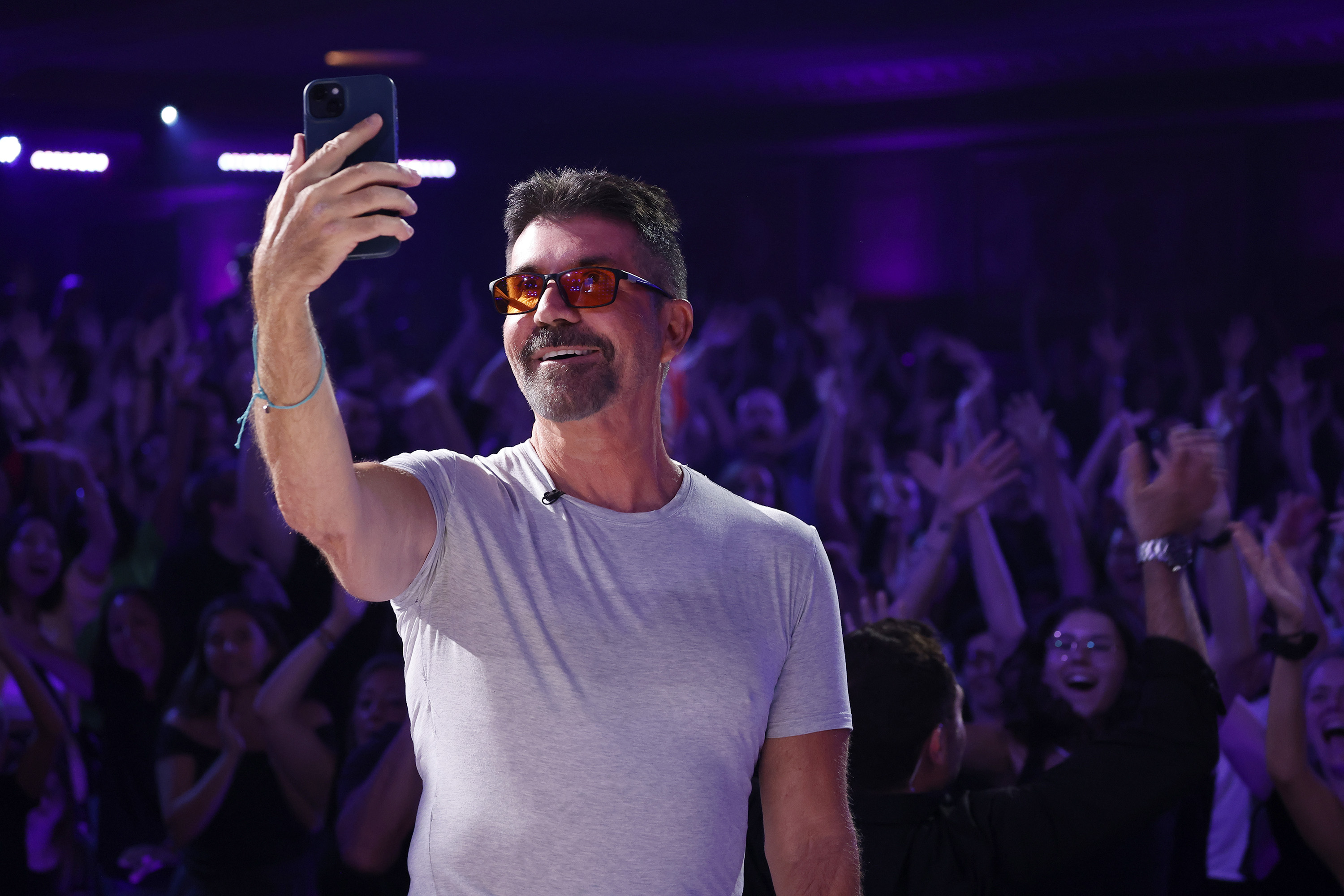 Simon Cowell takes a selfie with the audience ahead of the results episode of "America's Got Talent" Season 19 on 14 August 2024. | Source: Getty Images