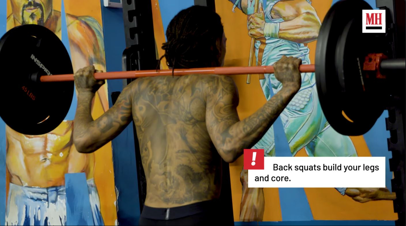 Wiz Khalifa performs back squats as part of the strength-training portion of his MMA-style workout routine. | Source: YouTube/Men's Health