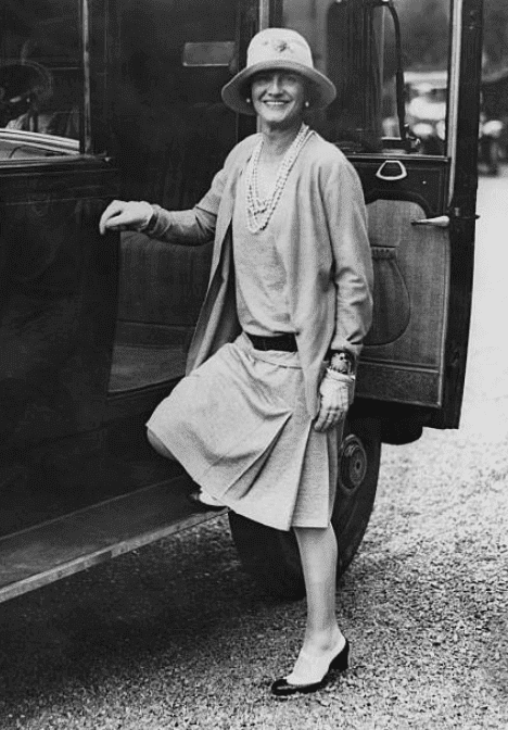 French fashion designer, Coco Chanel getting into a car in 1928, while visiting the resort town of Biarritz, France | Source: Getty Images