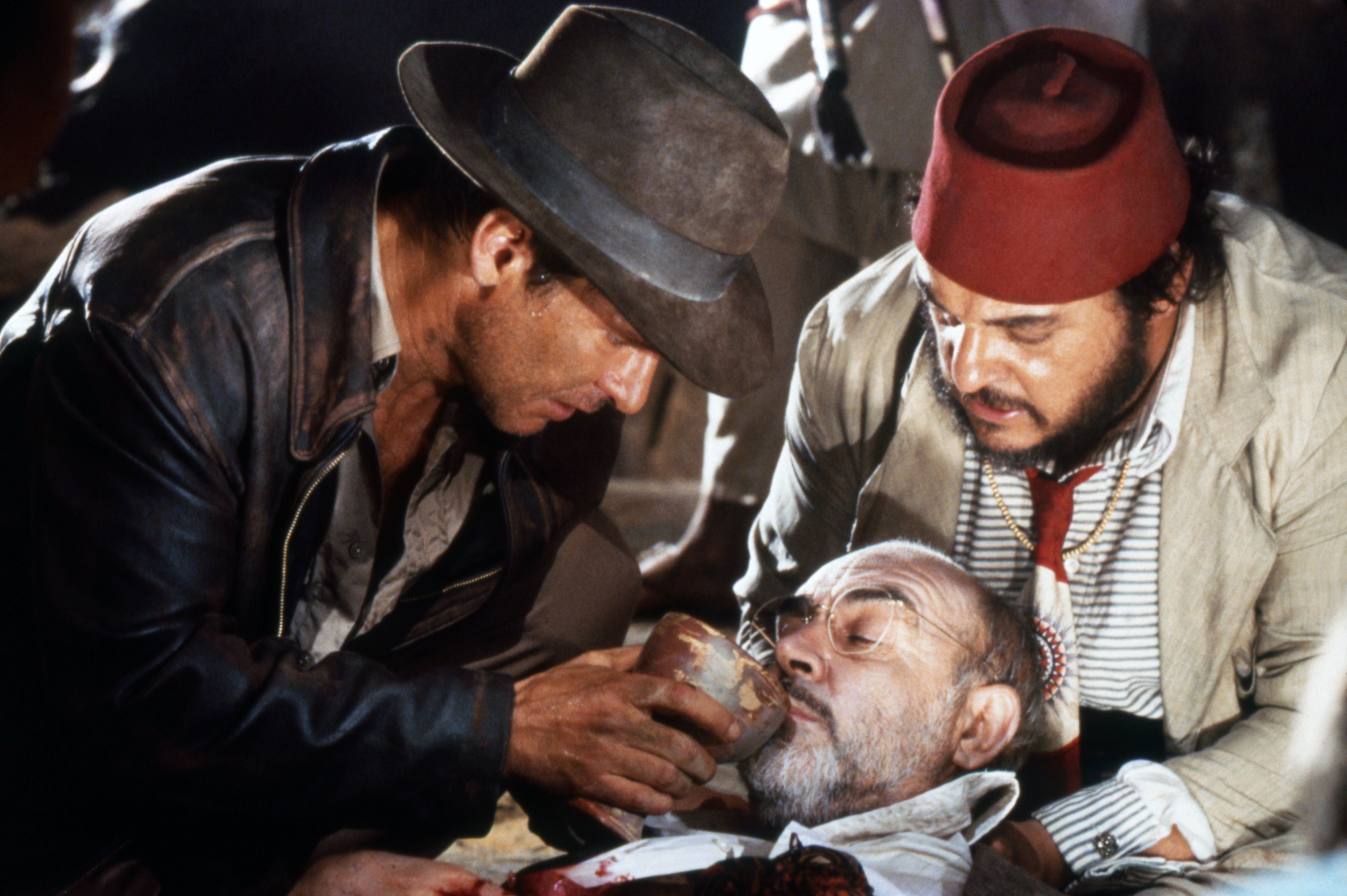 Harrison Ford, John Rhys-Davies, and Sean Connery on the set of "Indiana Jones and the Last Crusade." | Source: Getty Images