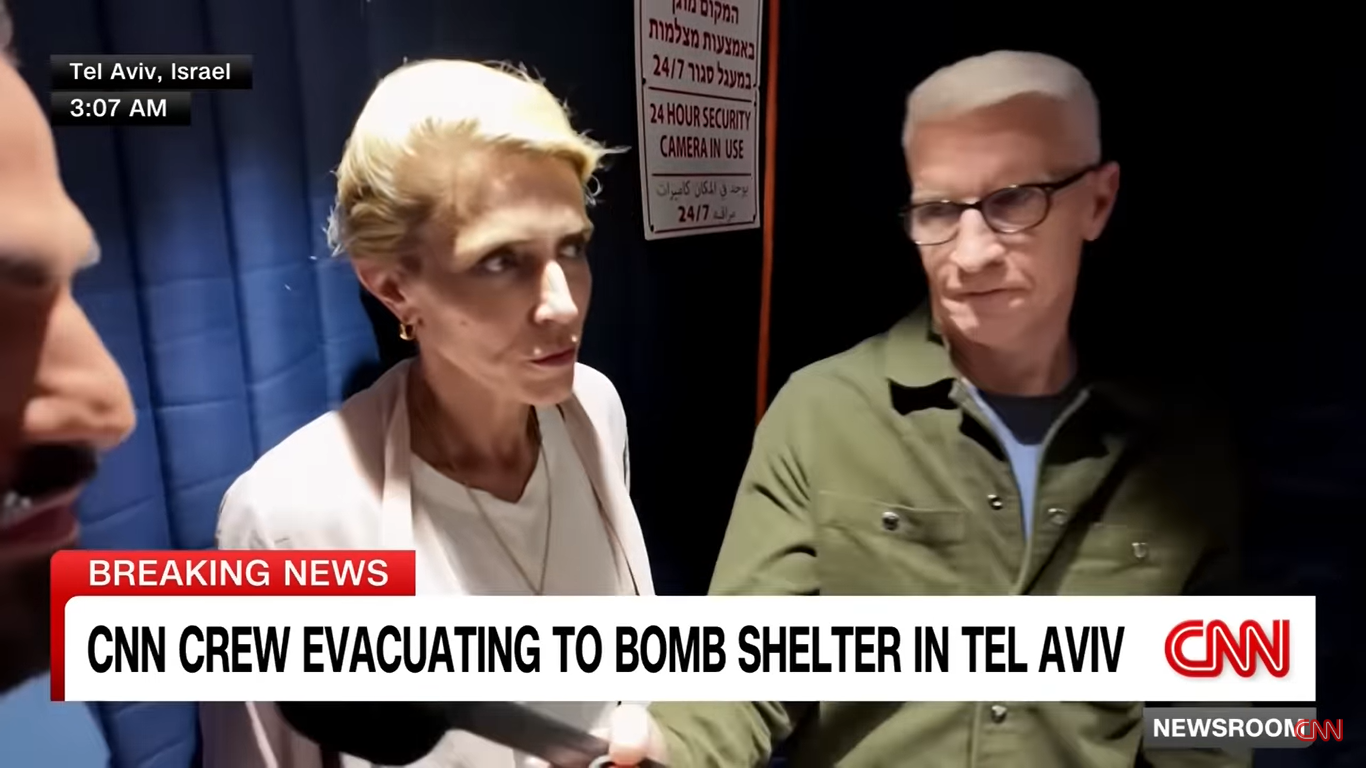 Jeremy Diamond, Clarissa Ward, and Anderson Cooper pictured inside the elevator during evacuation on June 23, 2025, in Tel Aviv, Israel. | Source: YouTube/CNN