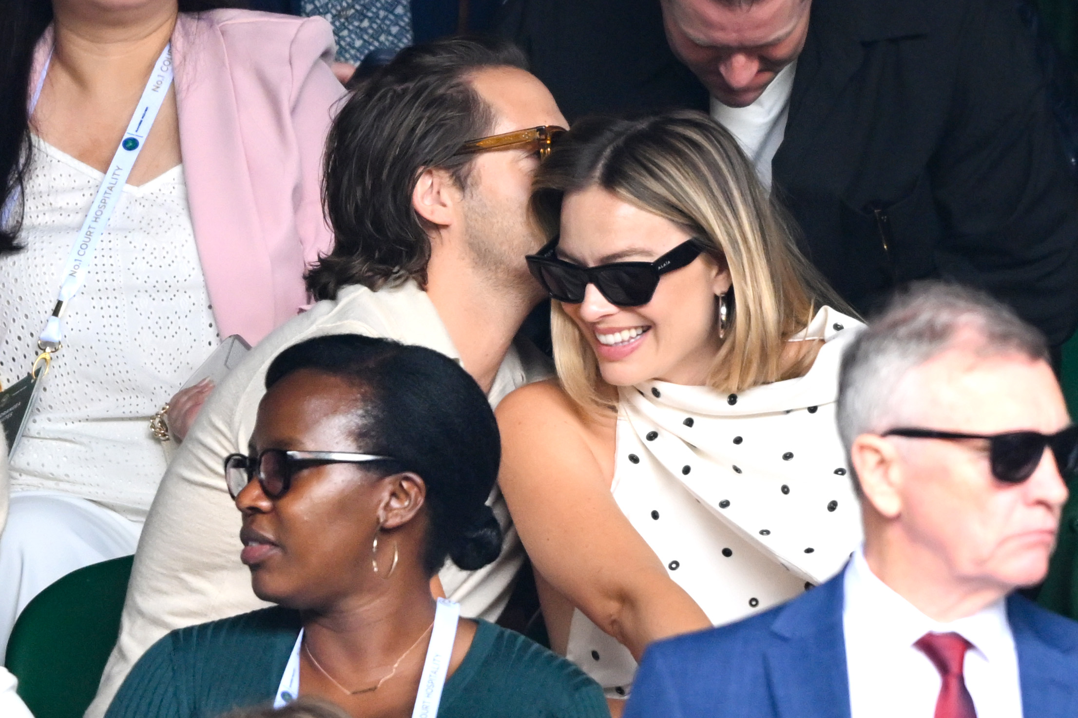 Margot Robbie and Tom Ackerley at the court-side of Centre Court on day twelve of the Wimbledon Tennis Championships at the All England Lawn Tennis and Croquet Club on July 12, 2024 in London, England | Source: Getty Images