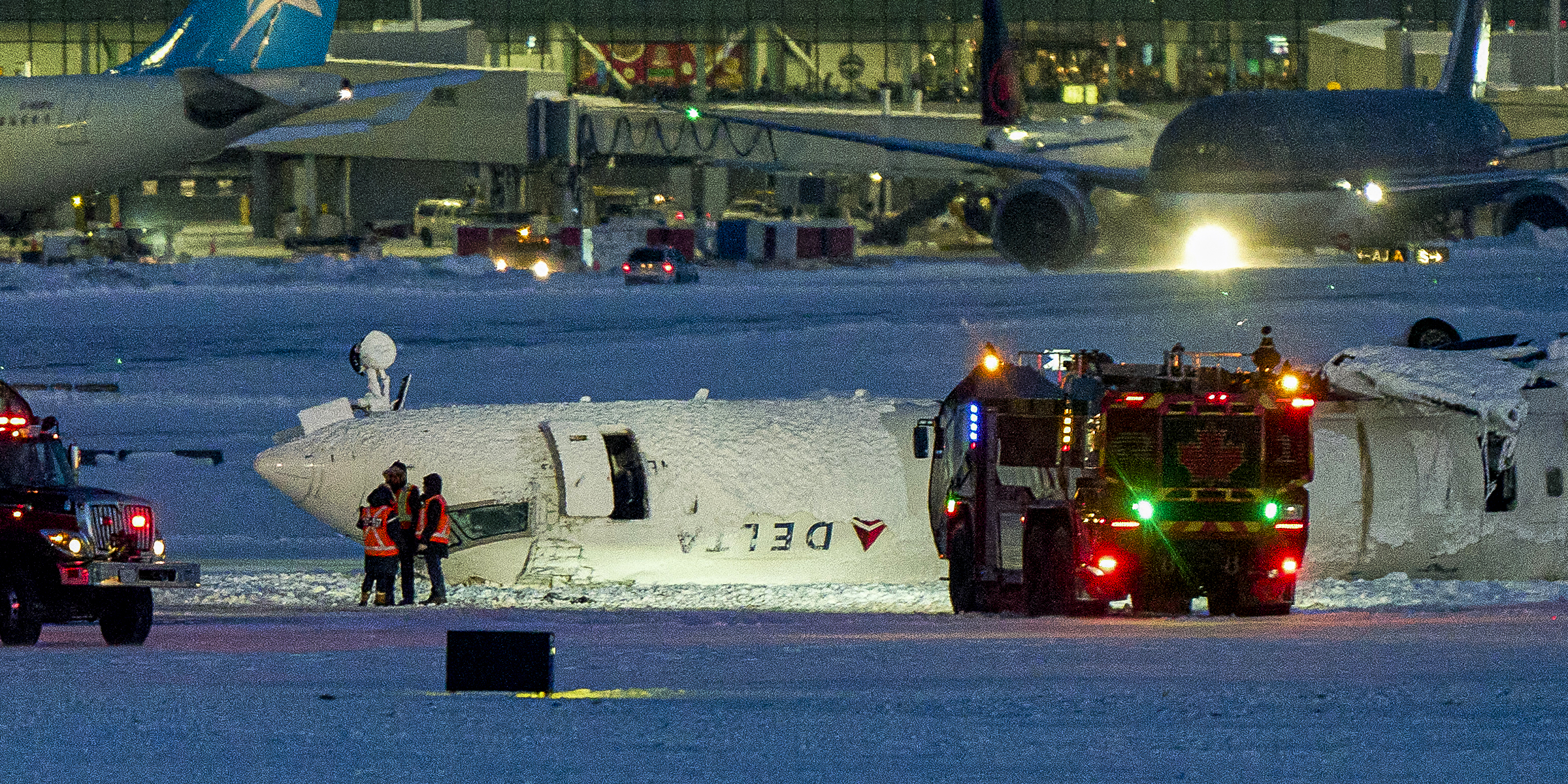 A Delta Airlines plane sits on its roof after crashing upon landing at Toronto Pearson Airport, 2025 | Source: Getty Images