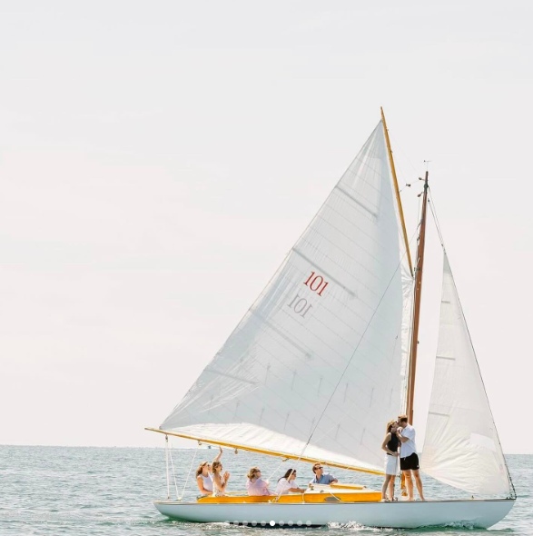 Tellef Lundevall and Mariah Kennedy Cuomo sharing a kiss on a sailboat, posted on July 24, 2024 | Source: Instagram/taylormadeexperience