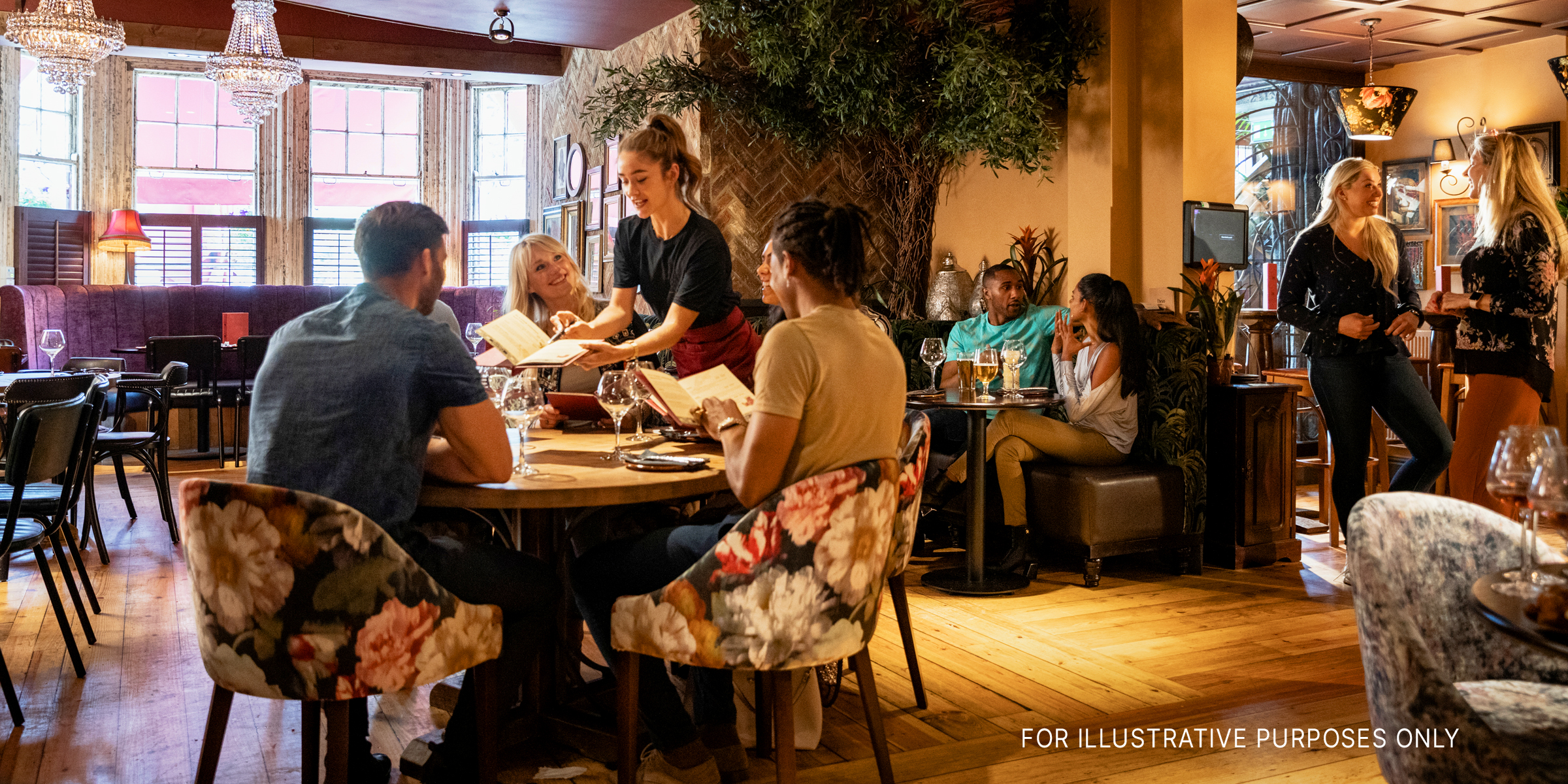 People dining in a restaurant | Source: Shutterstock