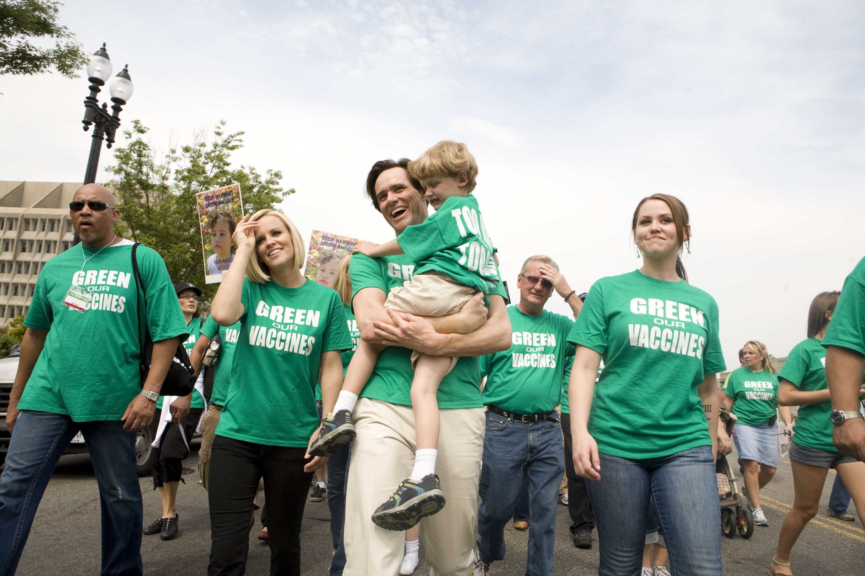 Actor Jim Carrey holds Evan Asher, son of actress Jenny McCarthy, during a march calling for healthier vaccines on June 4, 2008, in Washington, DC. | Source: Getty Images