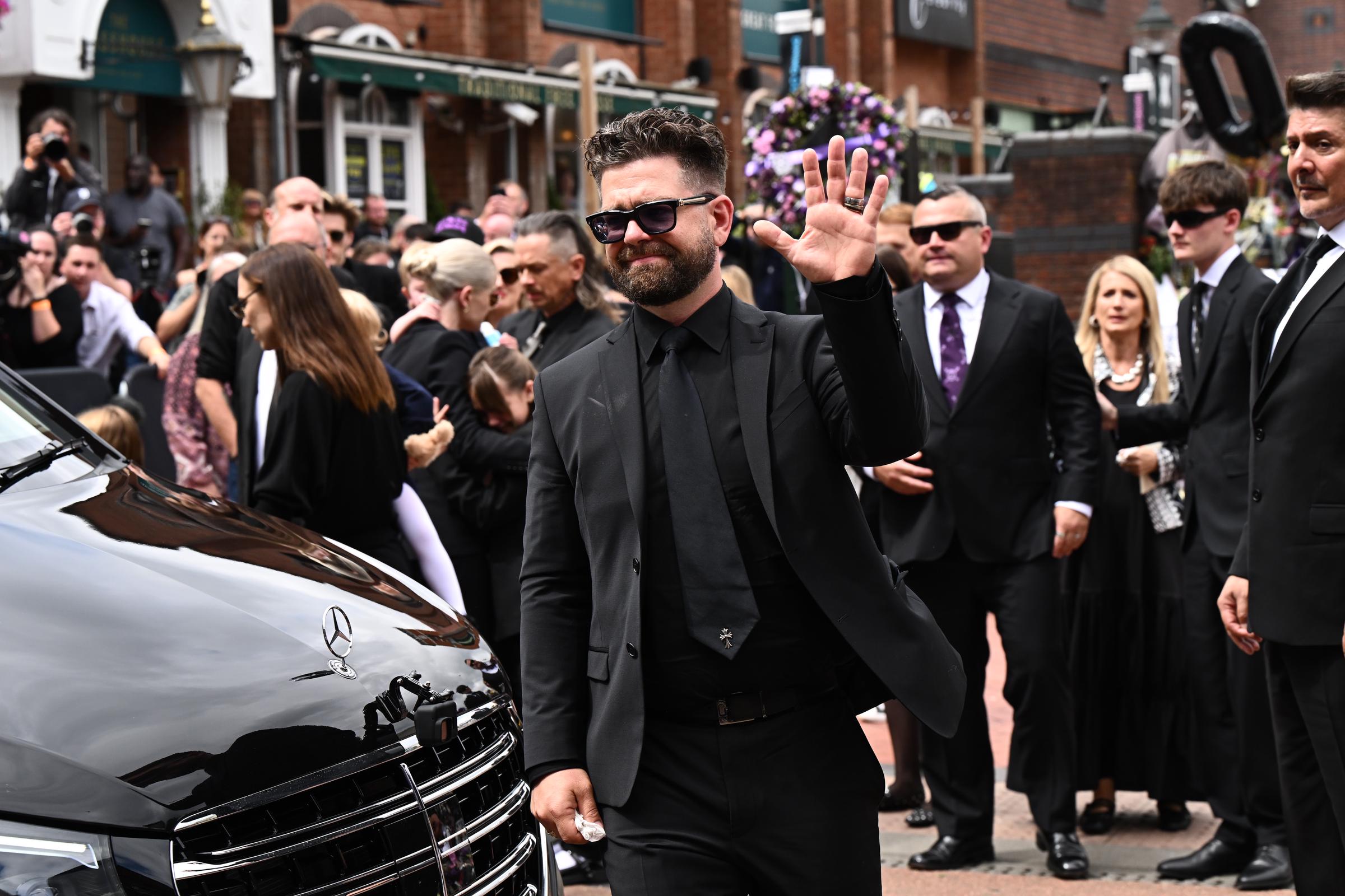 Jack Osbourne greets fans as he arrives to view tributes to his late father in Birmingham, England on July 30, 2025. | Source: Getty Images