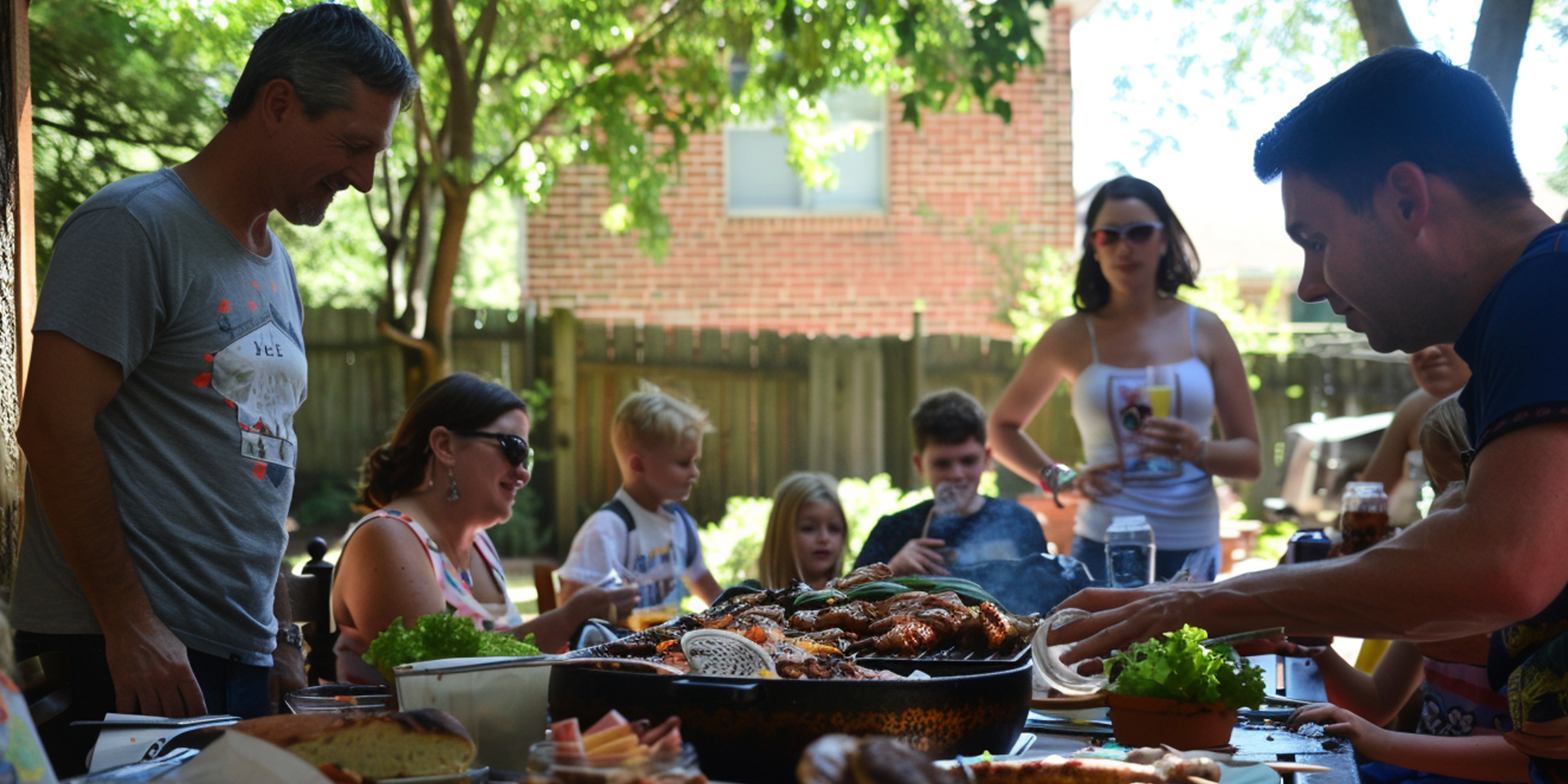 A family enjoying a BBQ party | Source: AmoMama