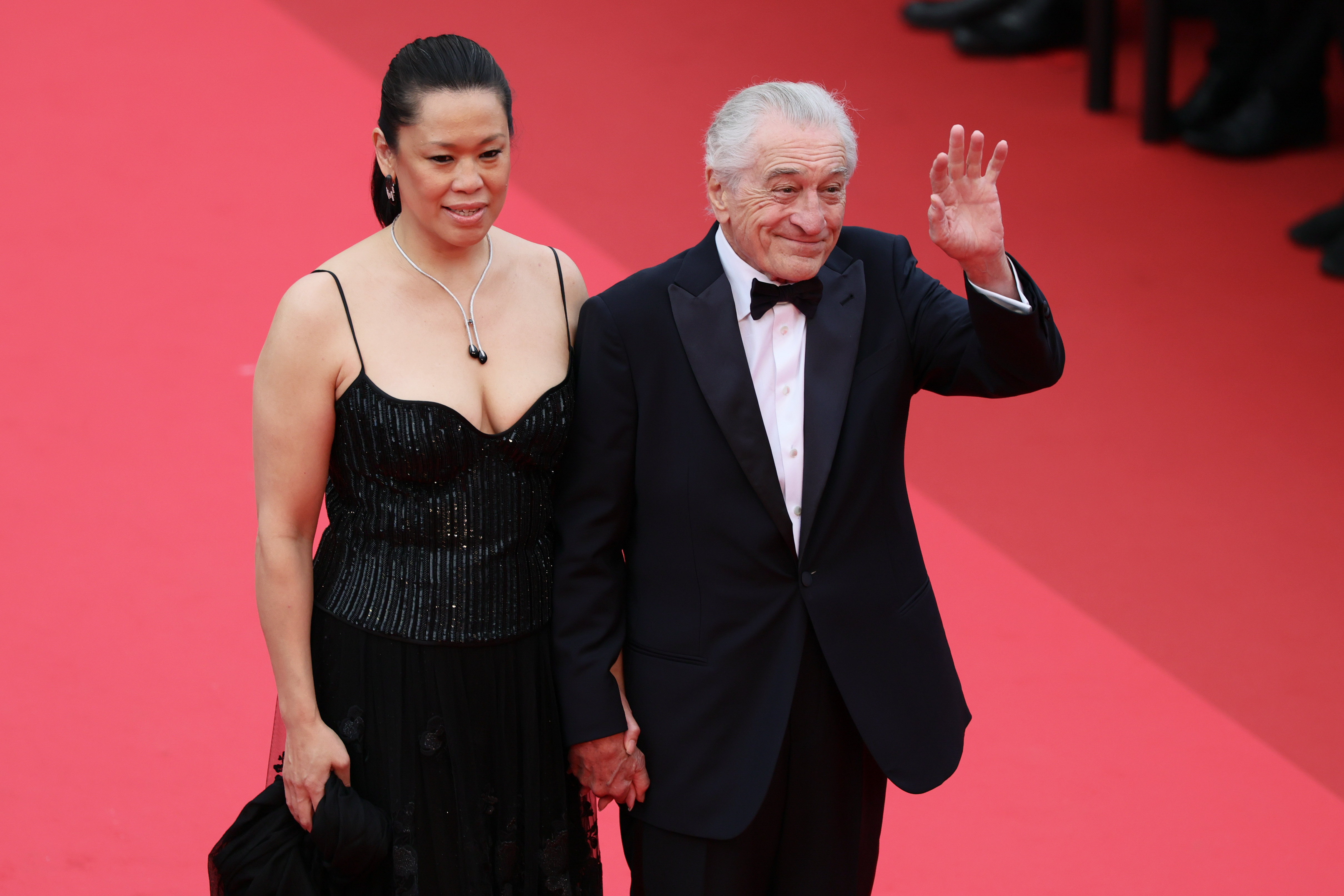 Robert De Niro and Tiffany Chen attend the red carpet at the 78th annual Cannes Film Festival at Palais des Festivals on May 13, 2025, in France | Source: Getty Images