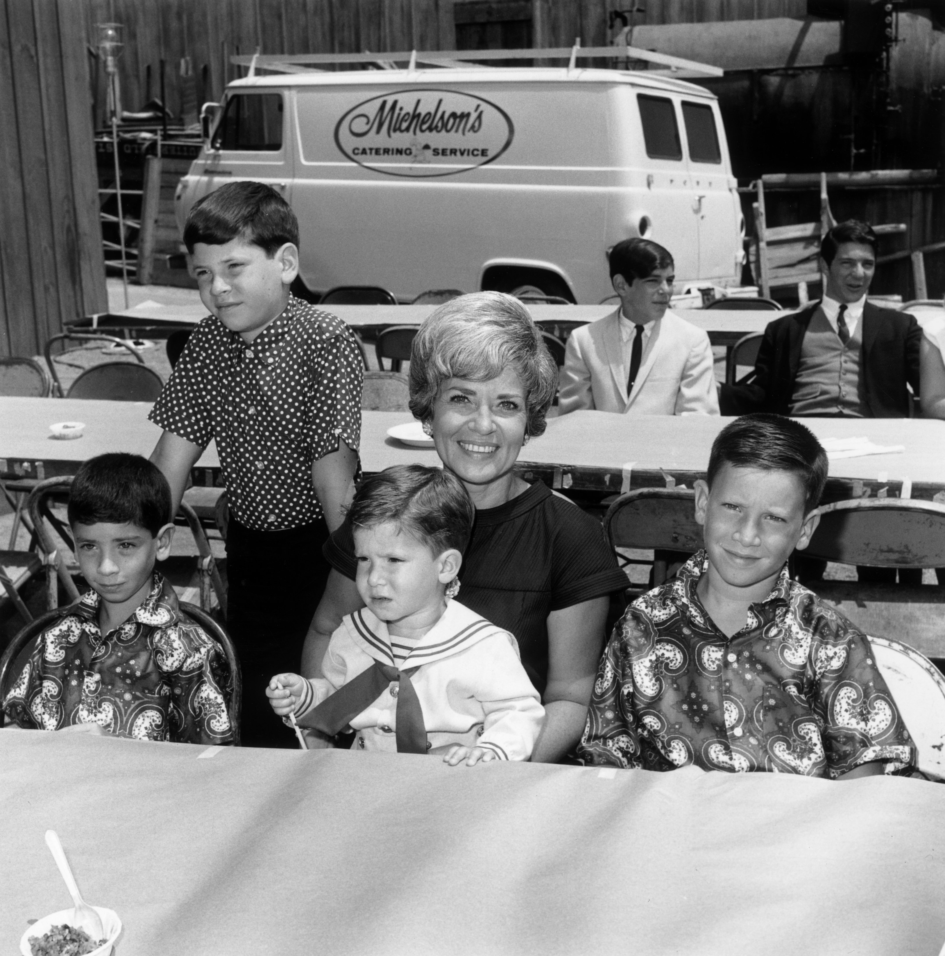 Singer Patti Palmer pictured with her children (left to right) Anthony, Chris, Joseph, and Scott at a children's party, a 'Batman' luncheon for an orphanage in August 1966 in California. / Source: Getty Images