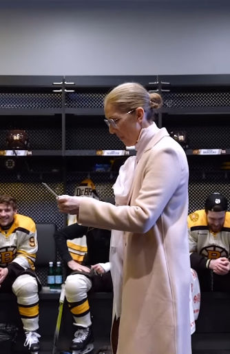 Celine Dion reading the lineup in the Bruins' locker room | Source: Instagram.com/nhlbruins