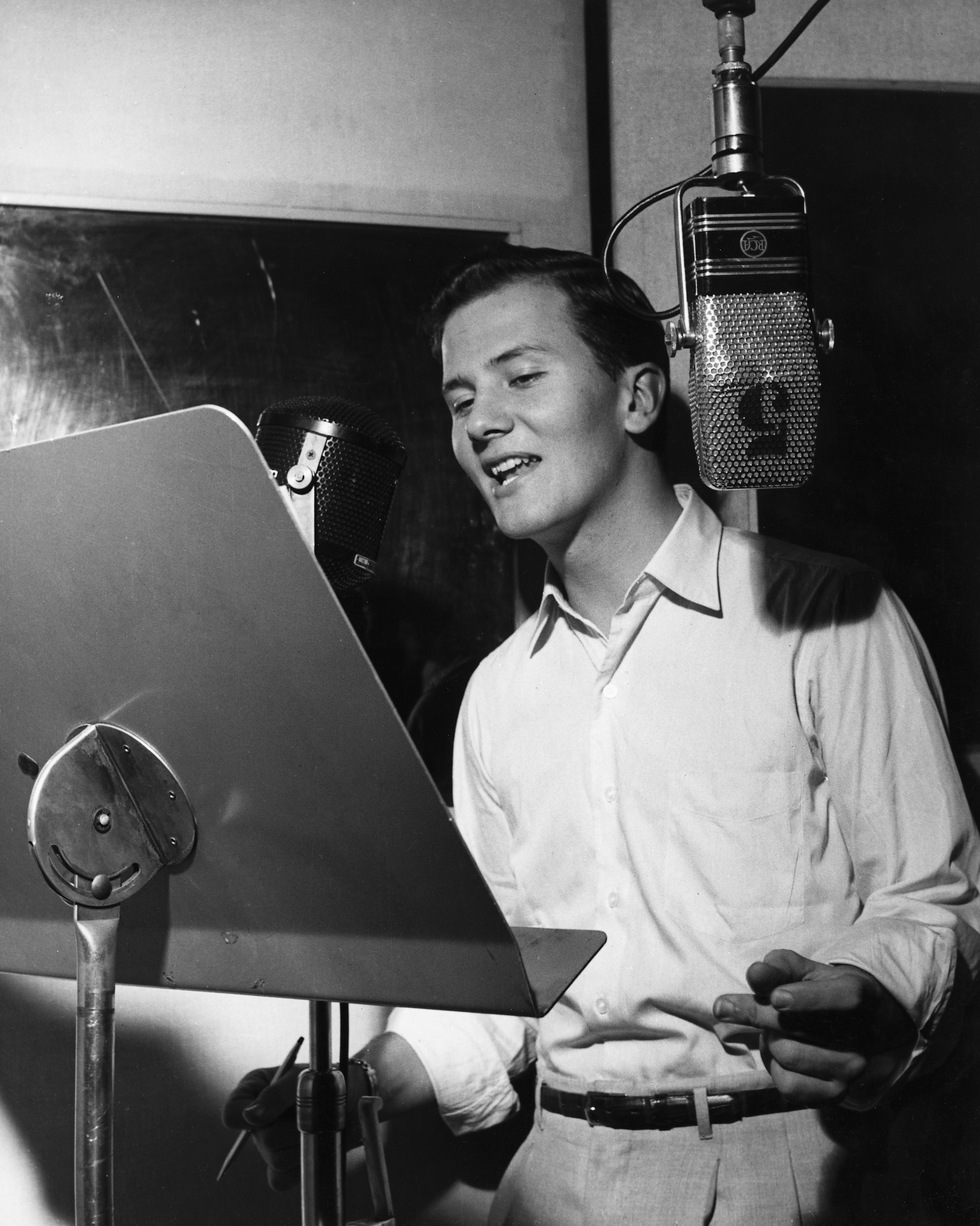 American actor and singer Pat Boone records a song, circa 1957 | Source: Getty Images