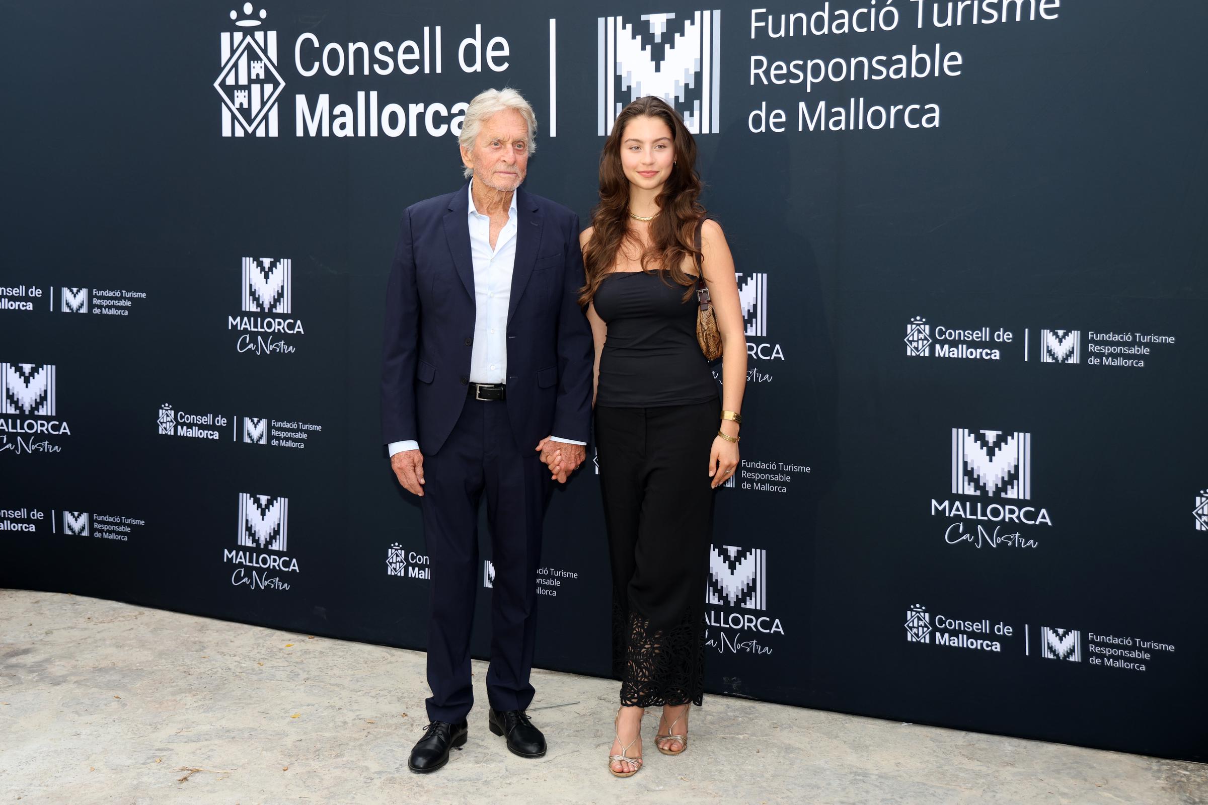 Michael Douglas and Carys Douglas' rare appearance together fueled a wave of reactions, with fans split over whether the 23-year-old resembles her father or her mother, Catherine Zeta-Jones. | Source: Getty Images