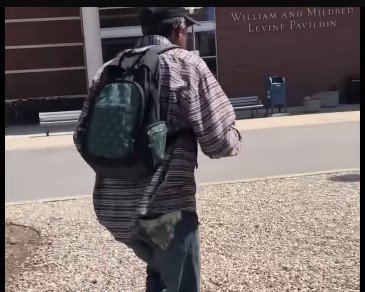 Picture of Luther Younger walking to see his wife at the hospital | Source: Youtube/CBS News