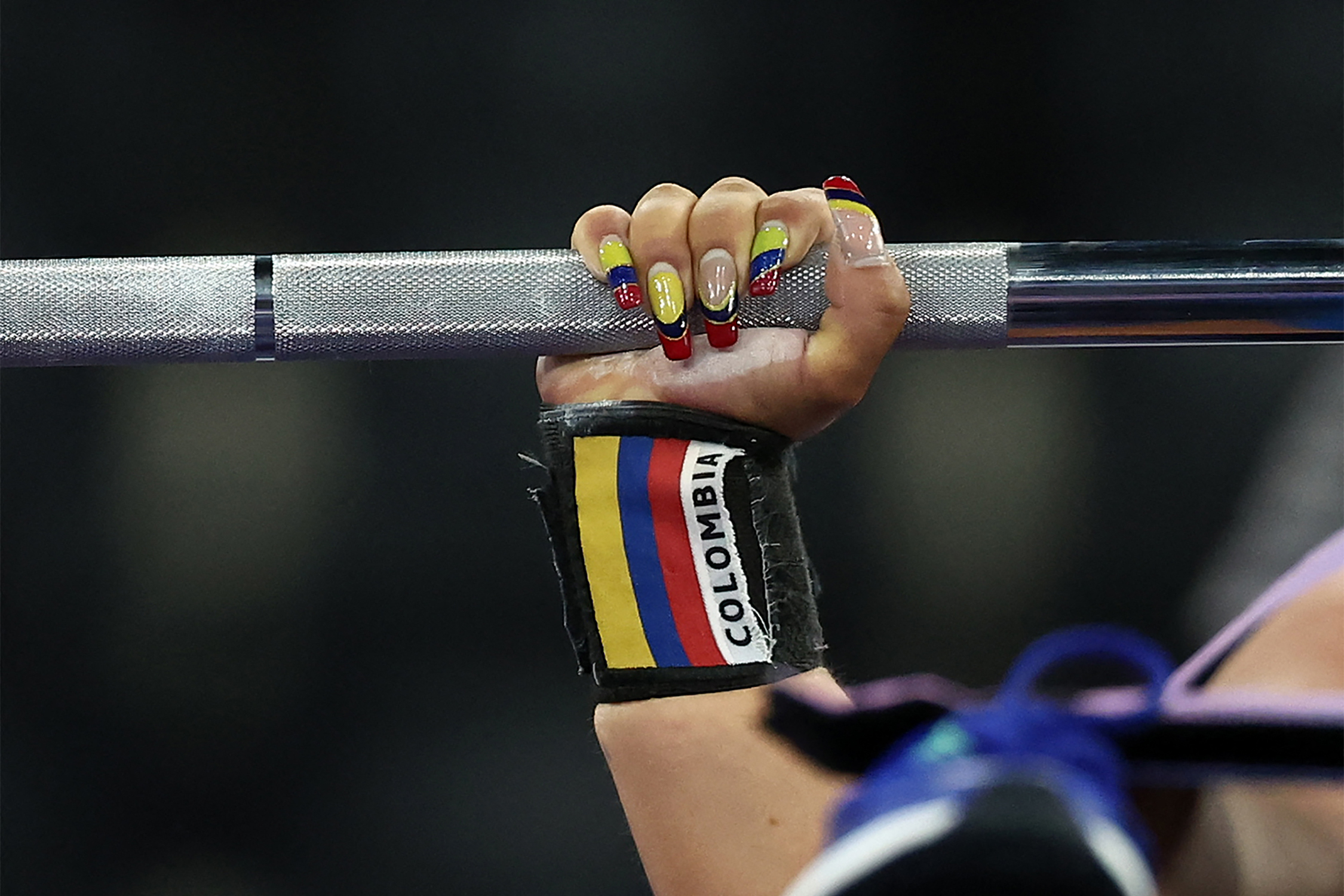 A closeup shot of Colombia's Cristina Poblador Granados competing in the Powerlifting Women's up to 41 kg final event during the Paris 2024 Paralympic Games at La Chapelle Arena in Paris, on September 4, 2024 | Source: Getty Images