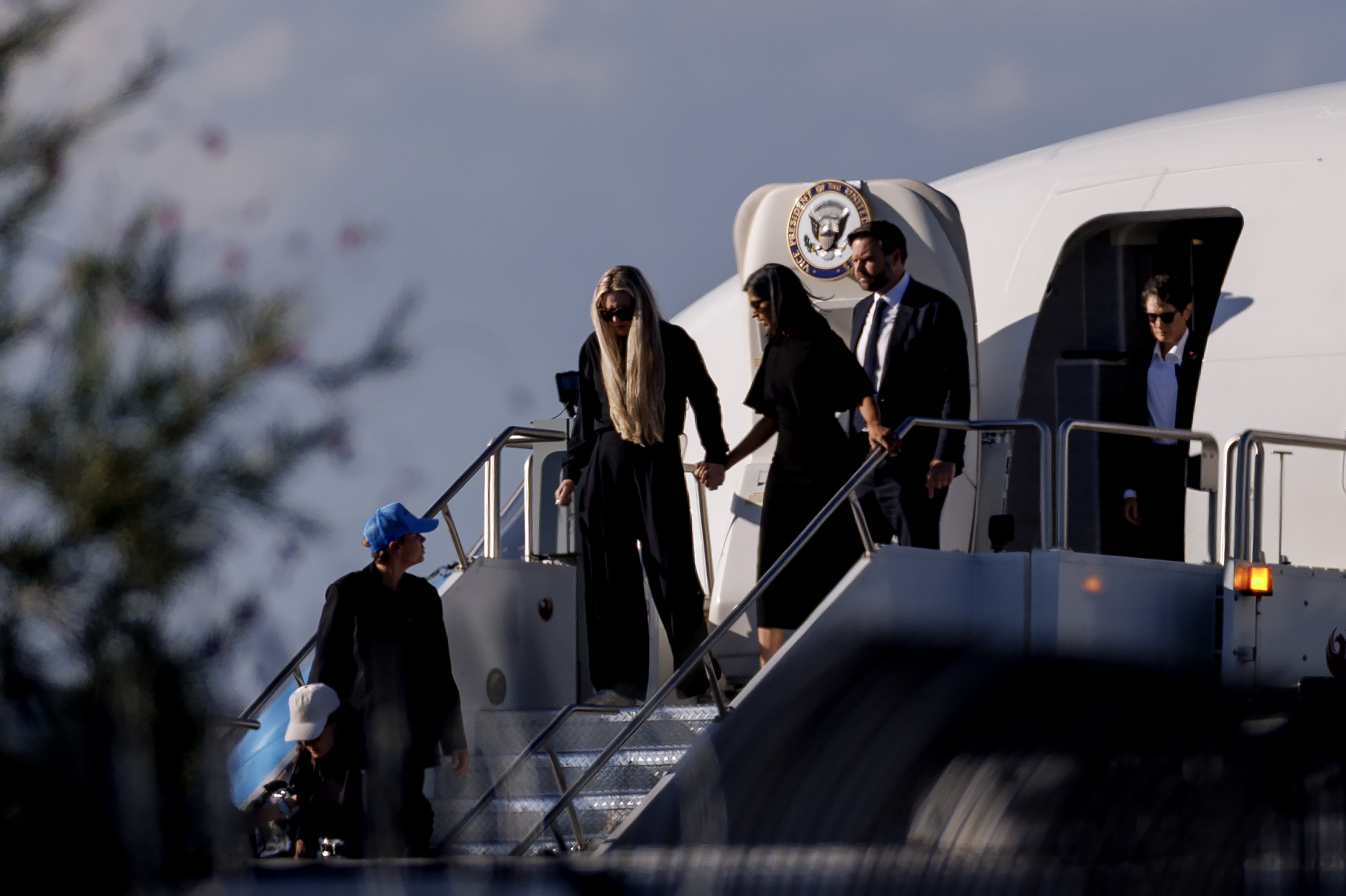 JD Vance (R), Usha Vance (C), and Erika Kirk deplane Air Force Two while escorting the body of Charlie Kirk on September 11, 2025, in Phoenix, Arizona | Source: Getty Images