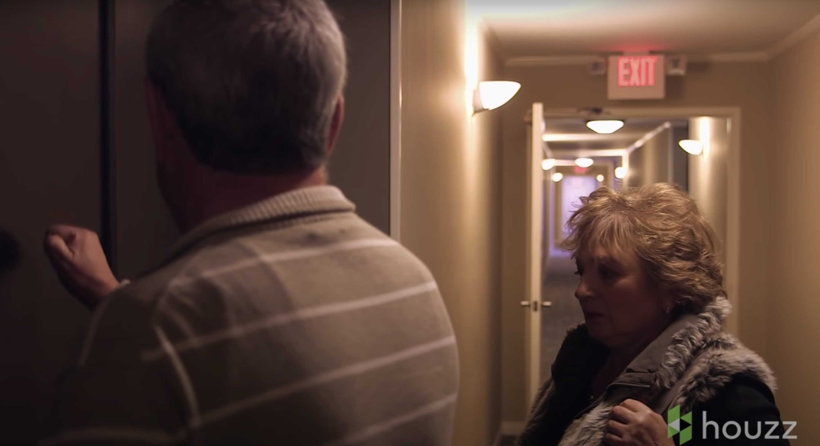 Mark and Elvira Kunis are pictured outside their condo's entrance door | Source: Youtube.com/HouzzTV