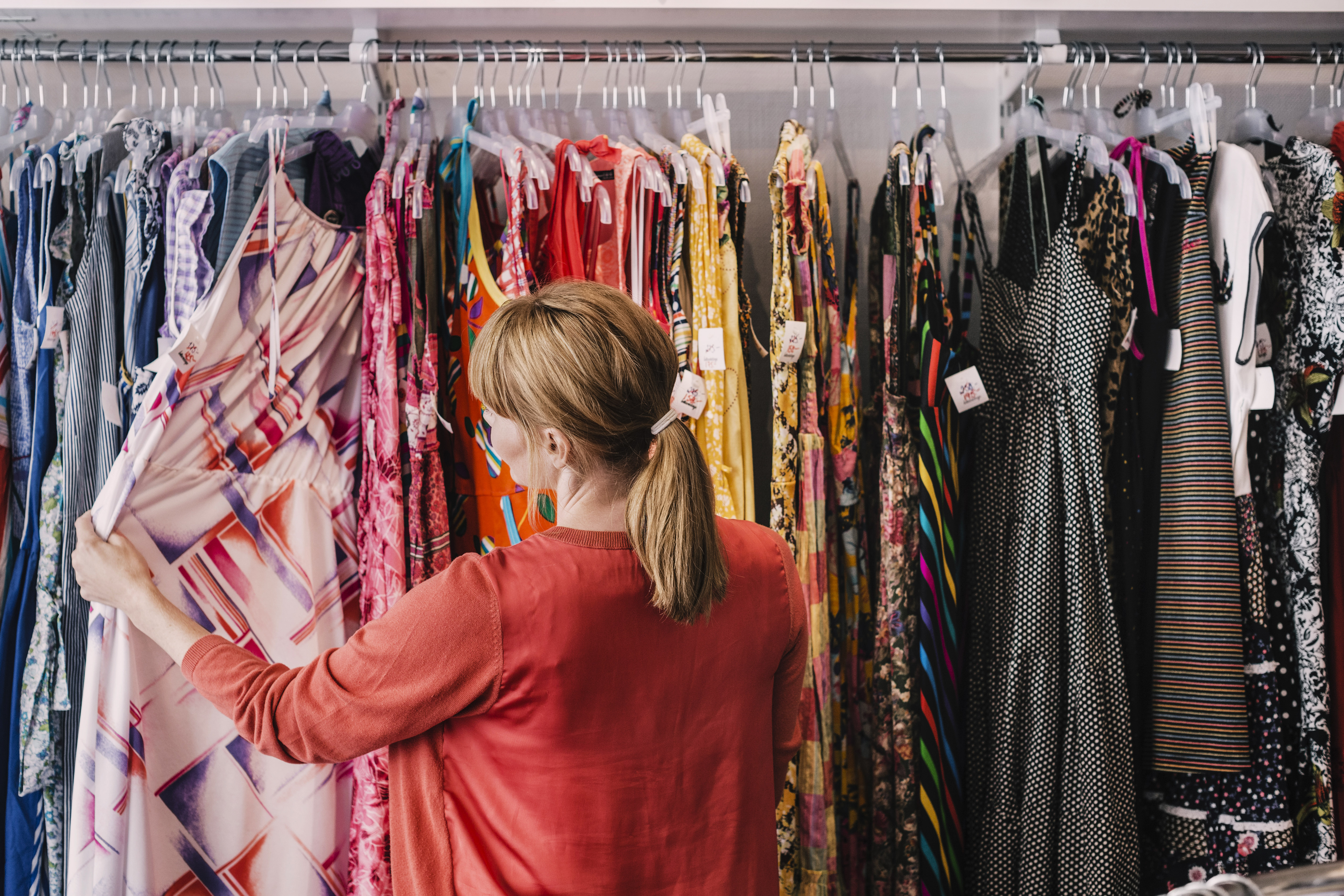 A woman looking at dresses in a store | Source: Getty Images