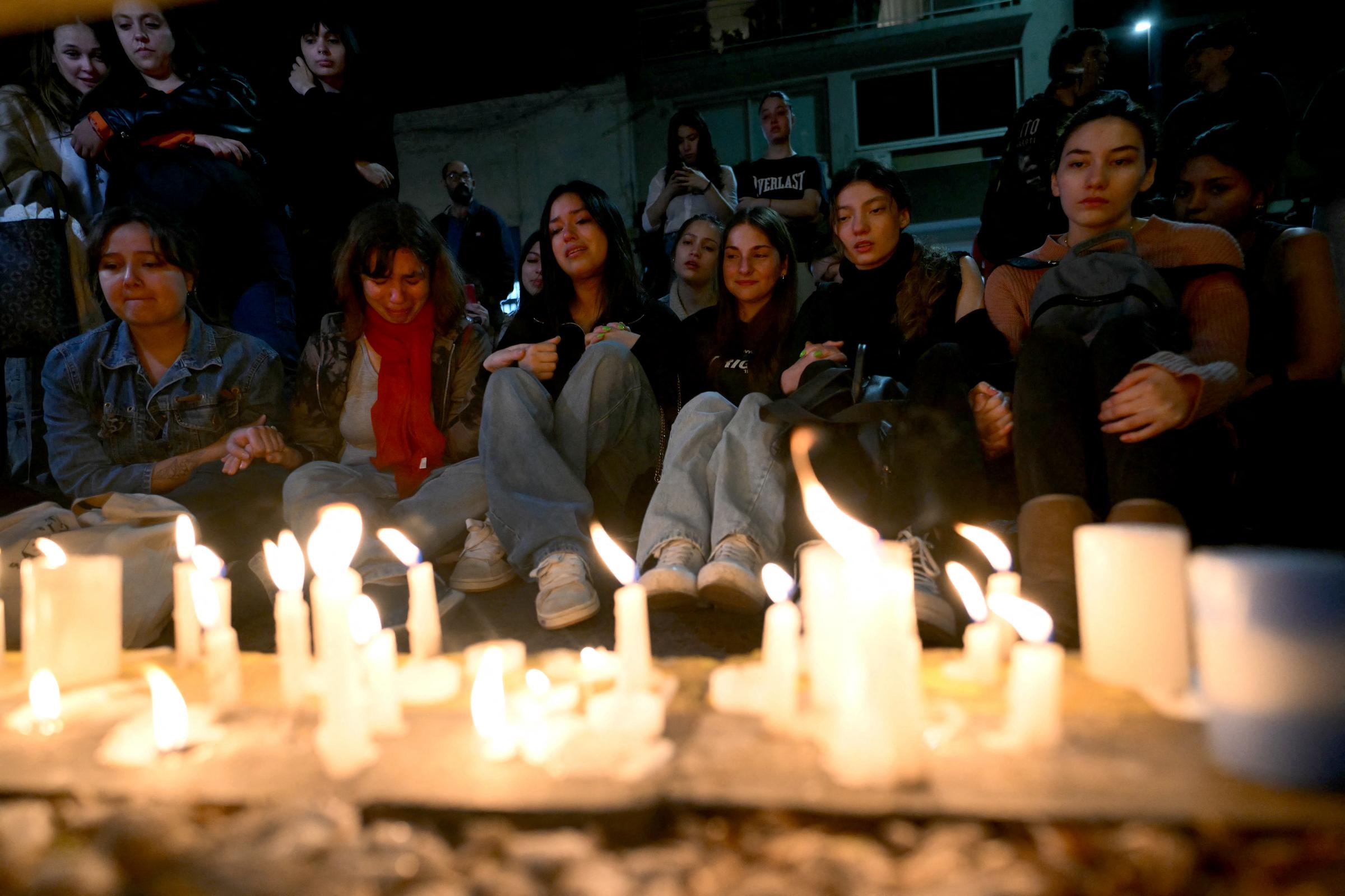 Liam Payne fans photographed with lit candles next to the hotel where he died in Buenos Aires, Argentina, on October 16, 2024. | Source: Getty Images