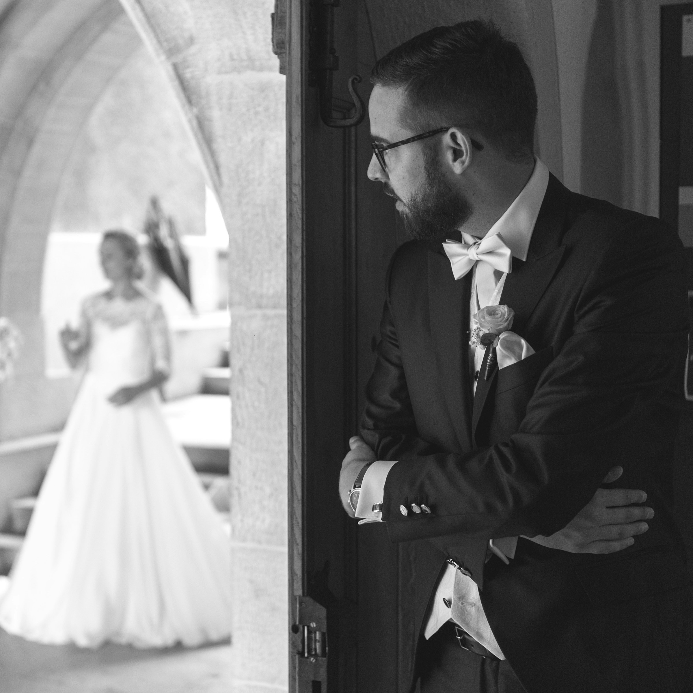 A man standing outside a church door and looking at the bride | Source: Unsplash