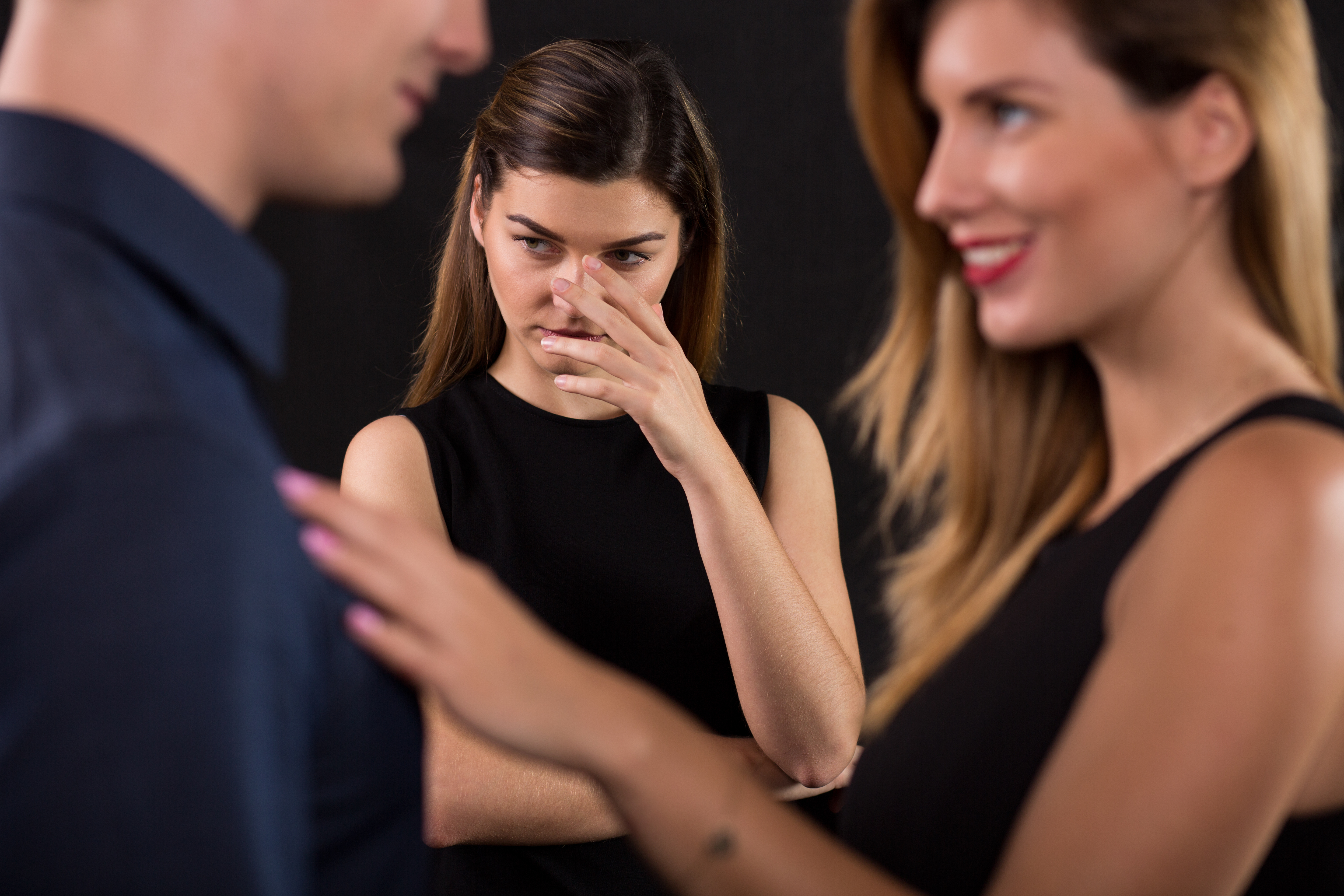 A husband cheating on his wife with another woman | Source: Shutterstock