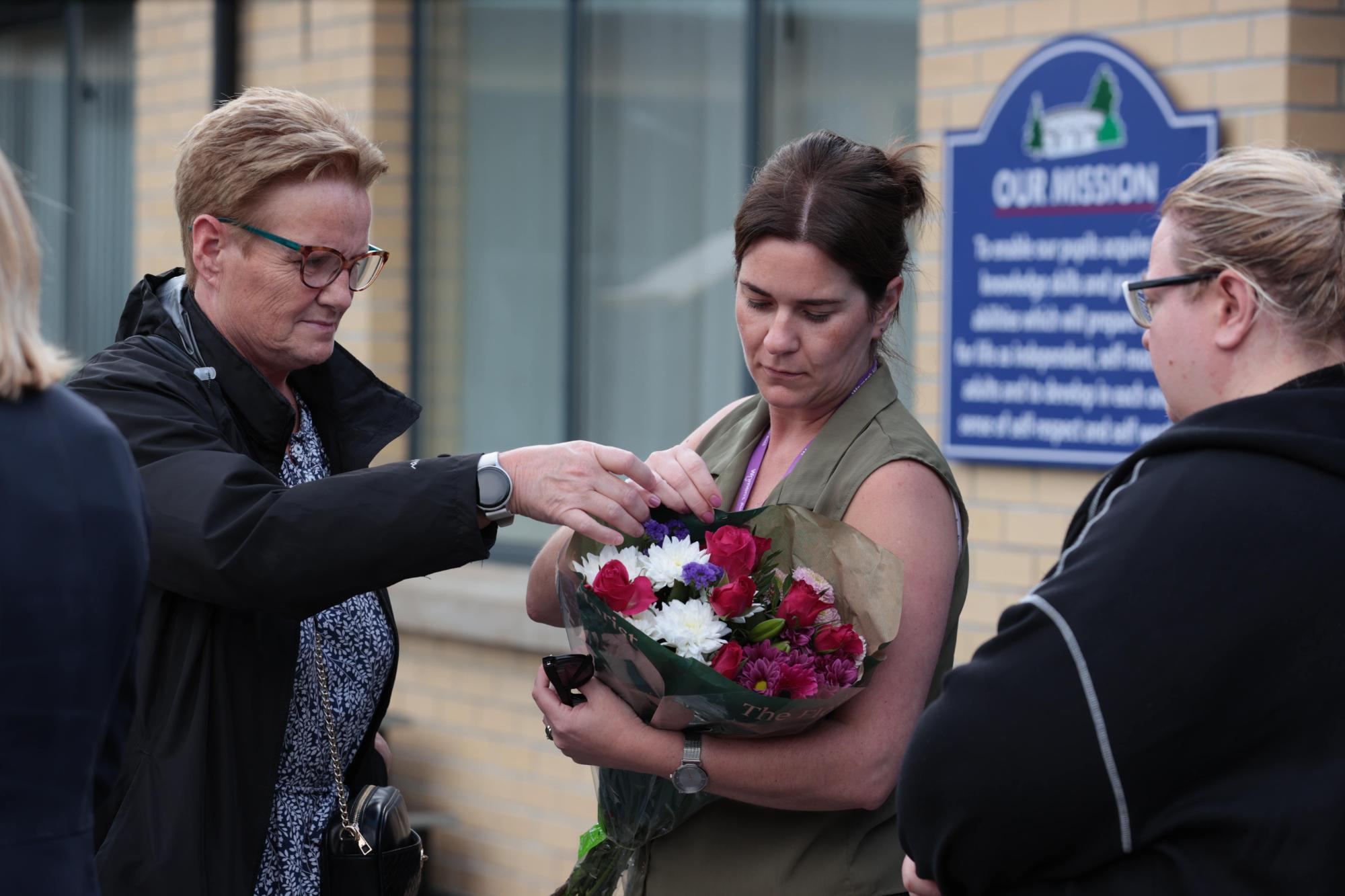 People gathered at a vigil for James Rutledge, Vanessa Whyte, and Sara Rutledge, from a post dated July 26, 2025 | Source: Facebook/irishmirror