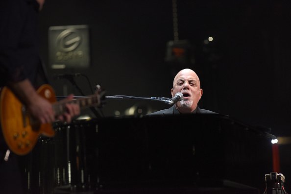 Billy Joel performing on stage at the Amway Center in Orlando, Florida. | Photo: Getty Images.