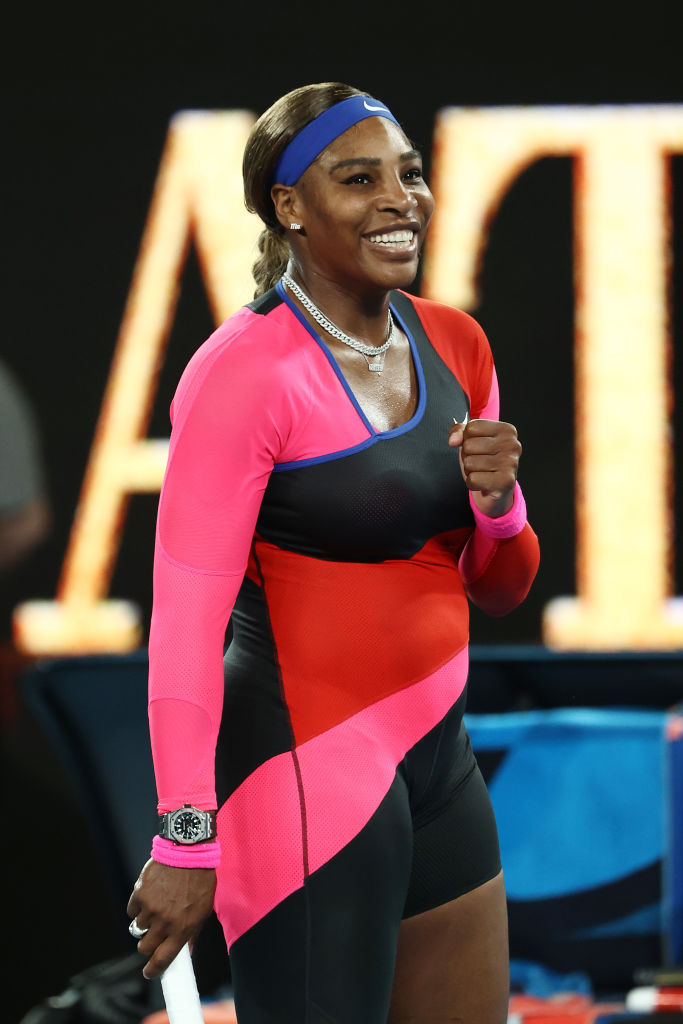 Serena Williams celebrated a victory during the Australian Open in February 2021, wearing a bold one-legged Nike catsuit in pink, red, and black.