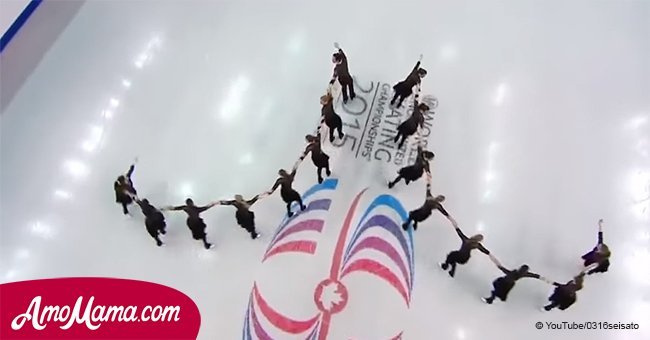 16 figure skaters line up in 4 columns. Then the music starts playing and everyone freezes
