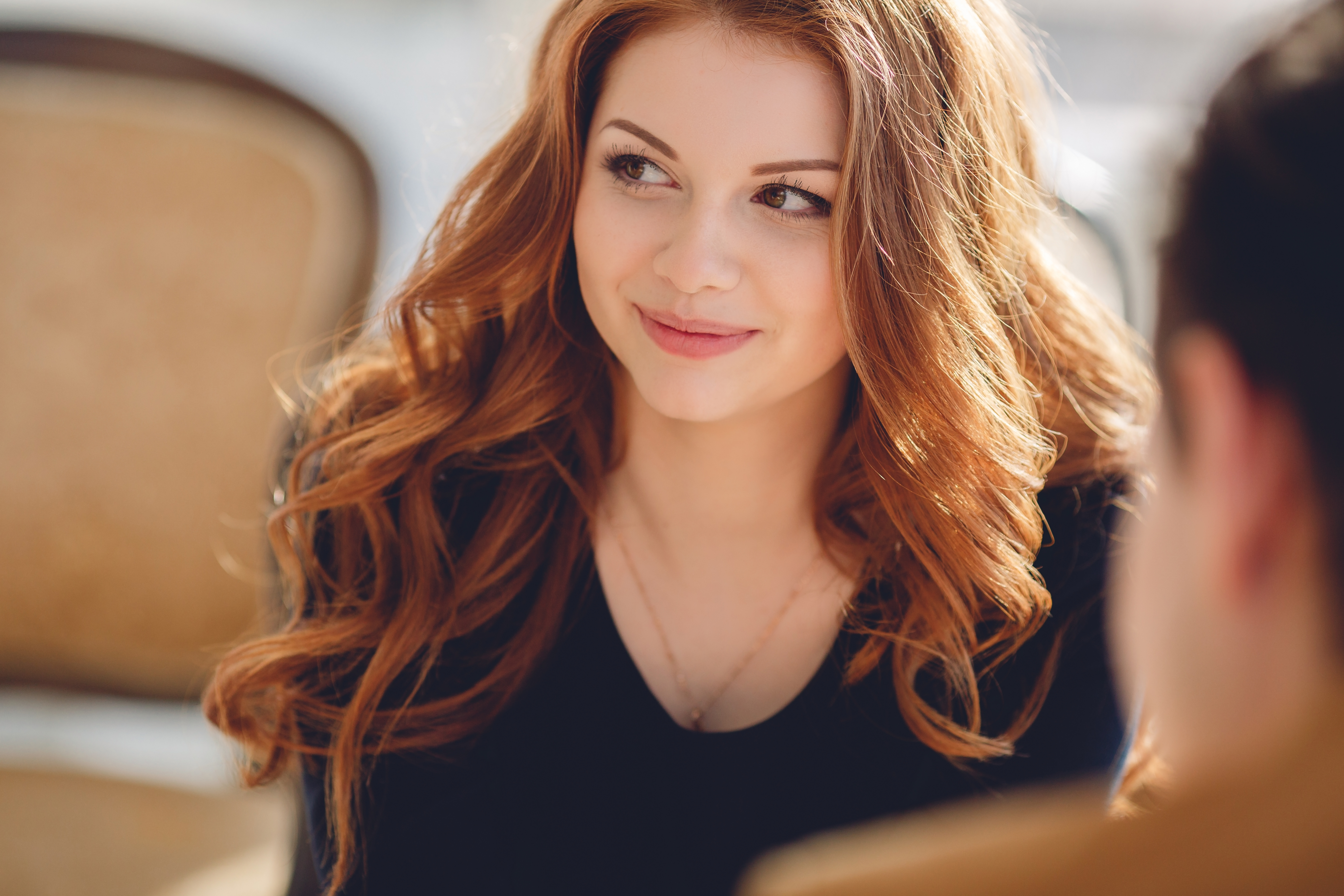 A young woman in a restaurant with a man | Source: Shutterstock