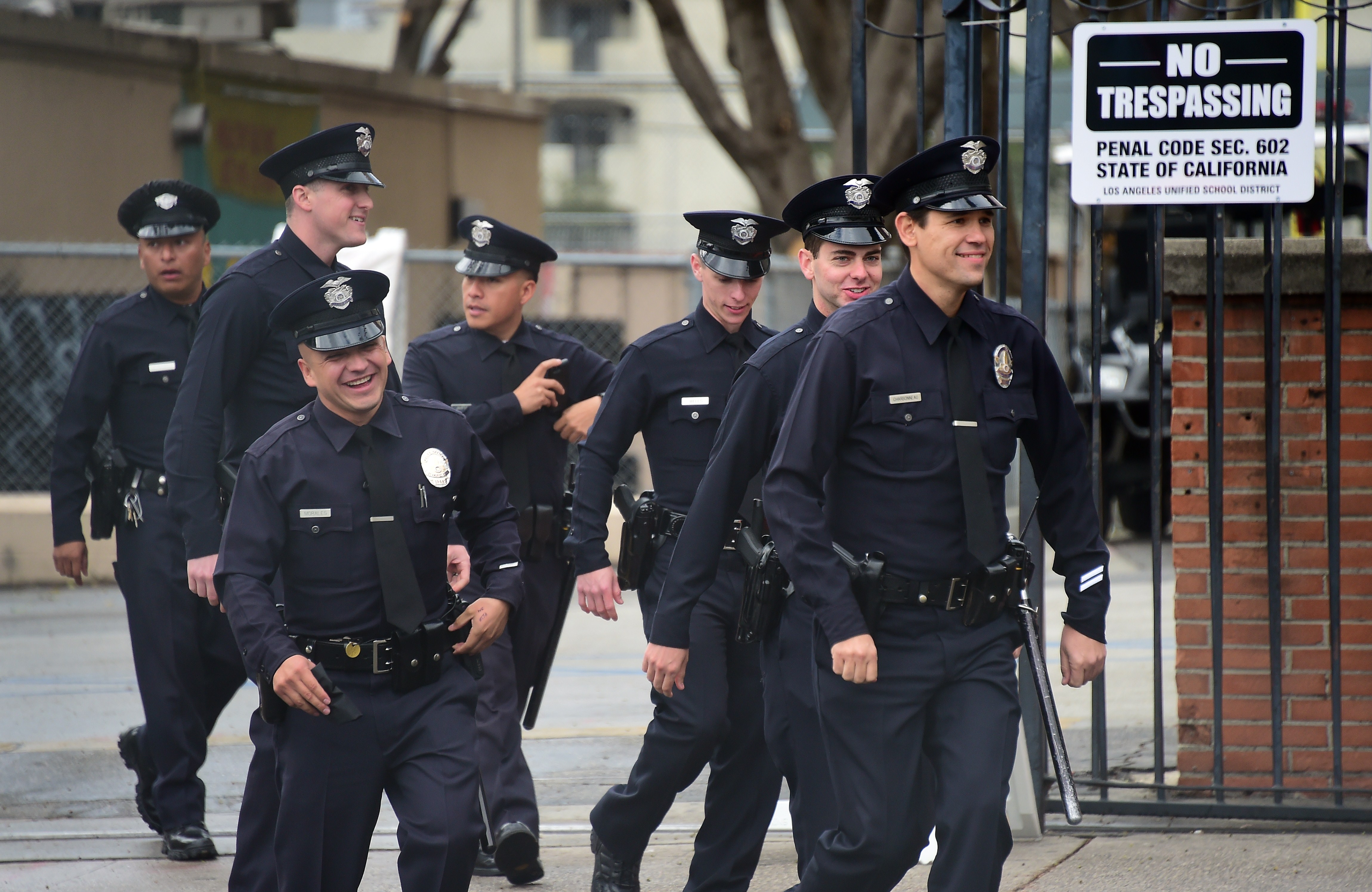 A group of police officers walk along Highand Avenue amid tightened security surrounding the 87th Annual Academy Awards in Hollywood, California on February 22, 2015 | Source: Getty Images