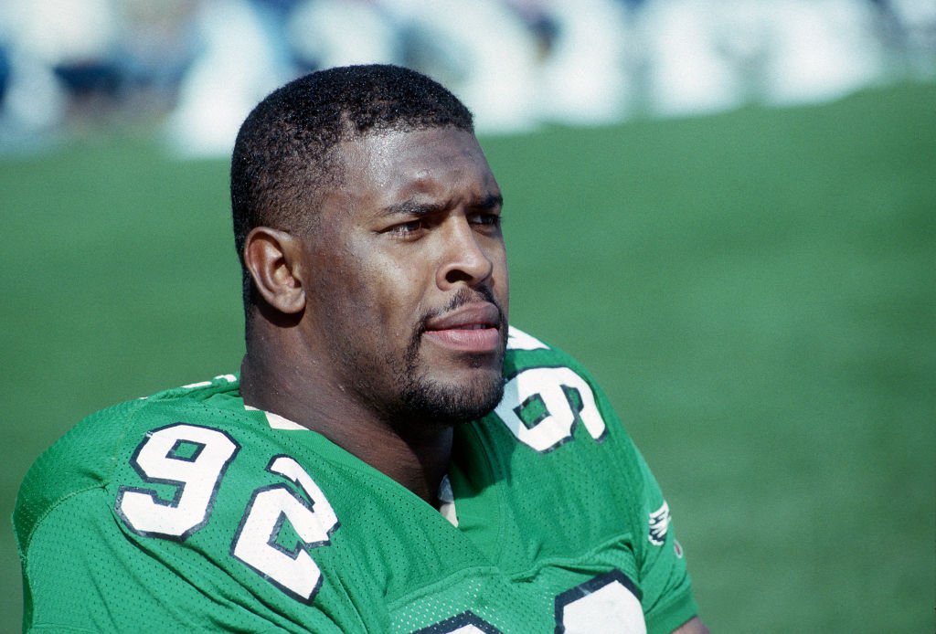 Reggie White looks on from the sideline during a game against the Cleveland Browns at Cleveland Municipal Stadium on October 16, 1988 in Cleveland, Ohio. | Source: Getty Images