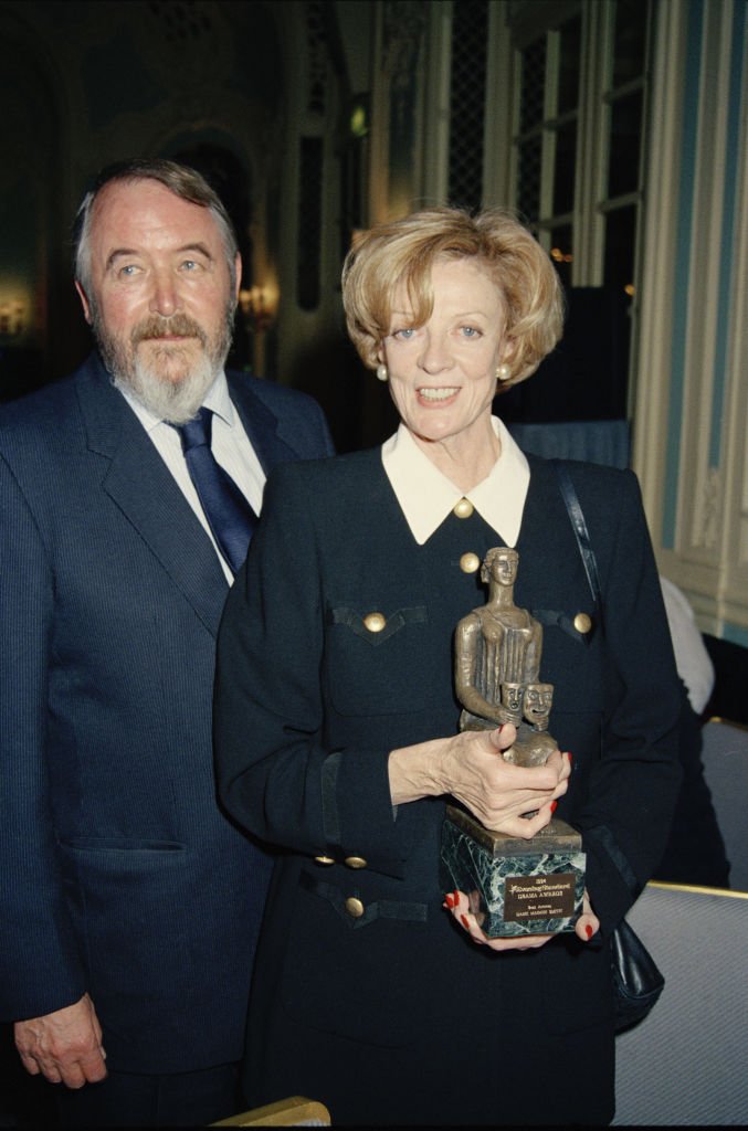 Maggie Smith with husband Beverly Cross in London in 1994 | Source: Getty Images 