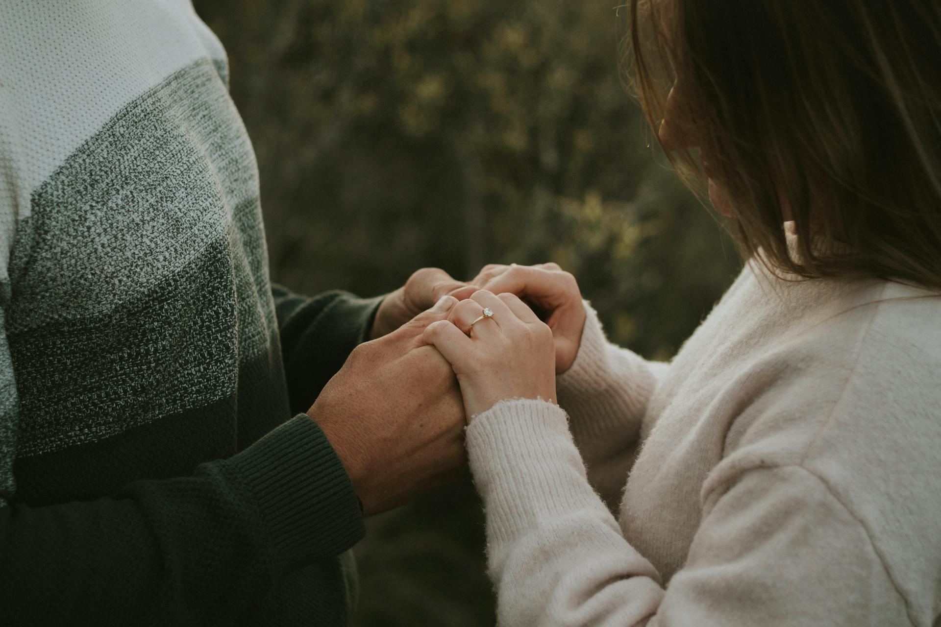 A man holding a woman's hands | Source: Pexels