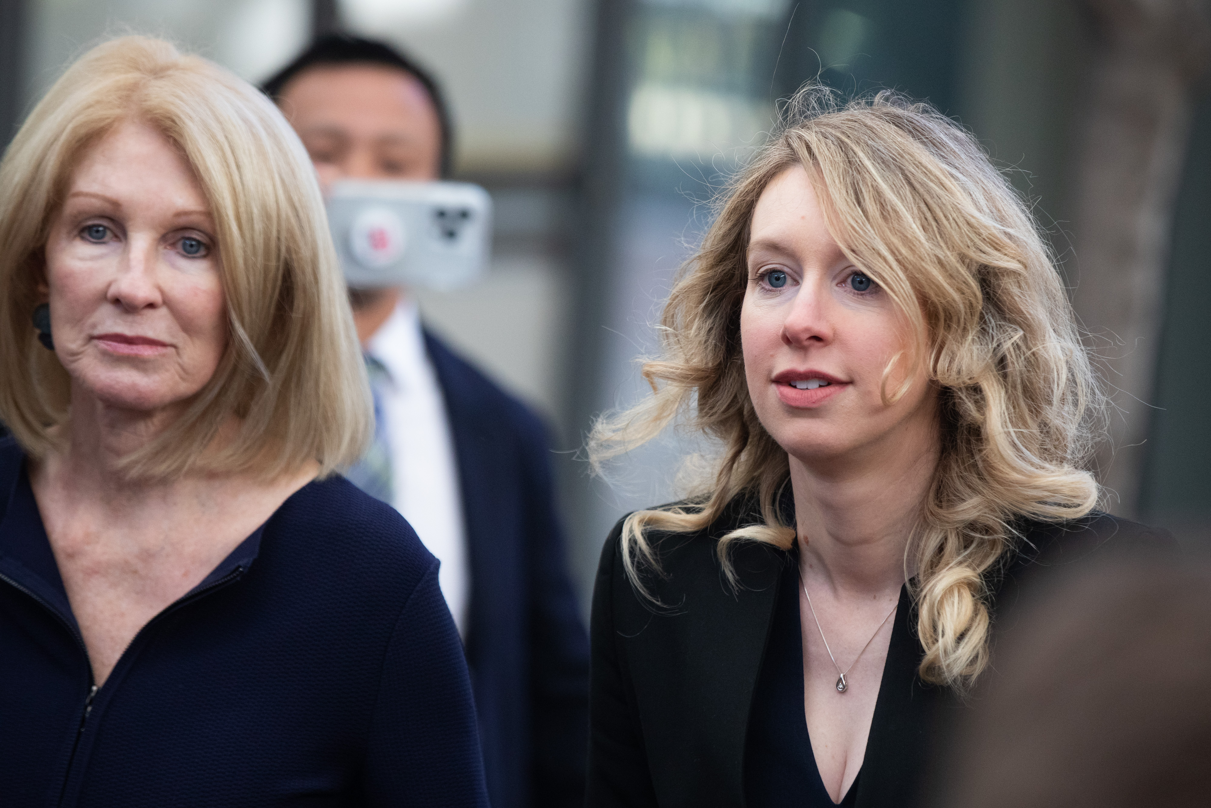 Elizabeth Holmes, founder of Theranos Inc., arrives at federal court with her mother Noel Holmes, left, in San Jose, California, US, on Friday, March 17, 2023. | Source: Getty Images