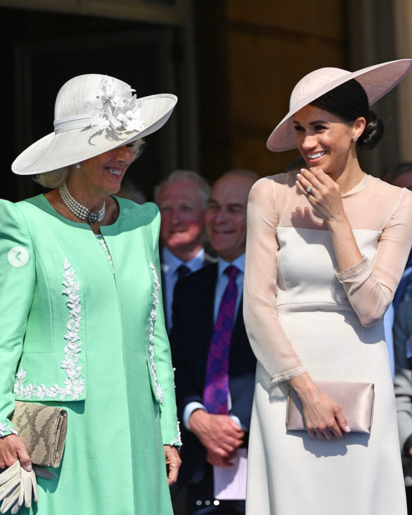 Another image in the 2019 birthday post showed Meghan sharing a smile with Camilla during a public engagement. The tribute was published on Clarence House's official Instagram account when King Charles III was still Prince of Wales. | Source: Instagram/clarencehouse