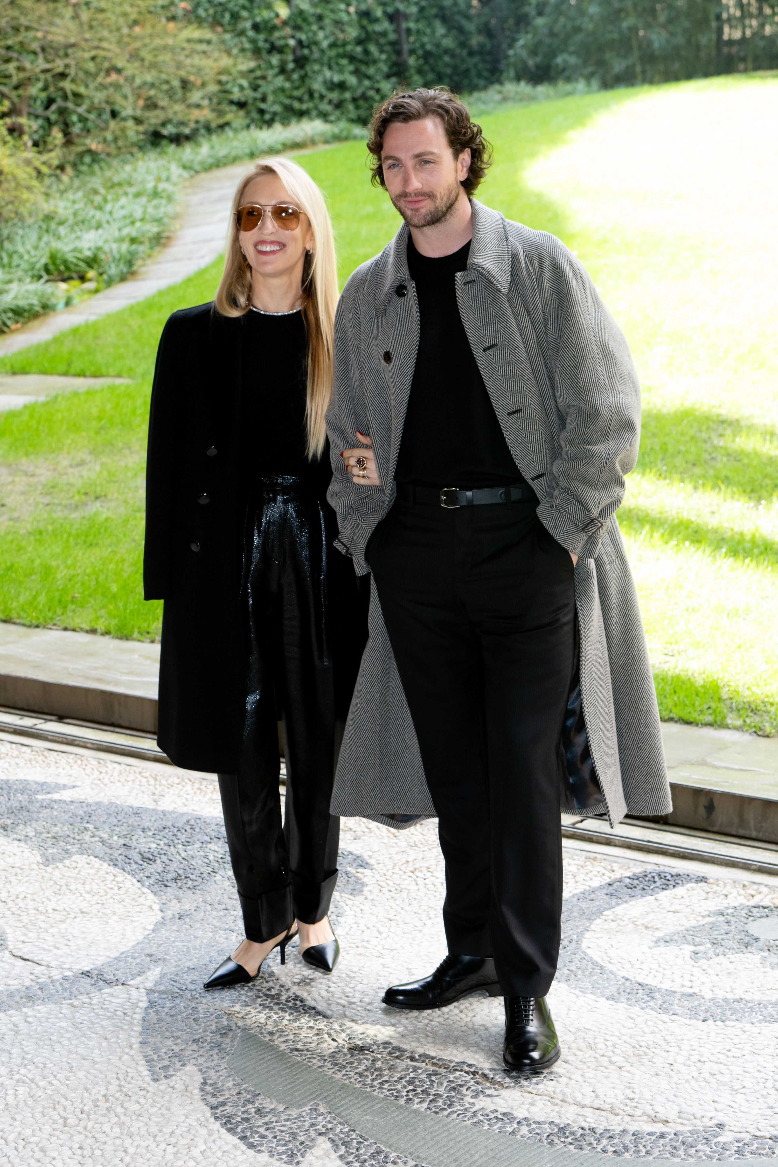 British photographer and director Sam Taylor-Johnson and British actor and screenwriter Aaron Taylor-Johnson are pictured at Giorgio Armani fashion show at Milan Fashion Week, on February 25, 2024 | Source: Getty Images