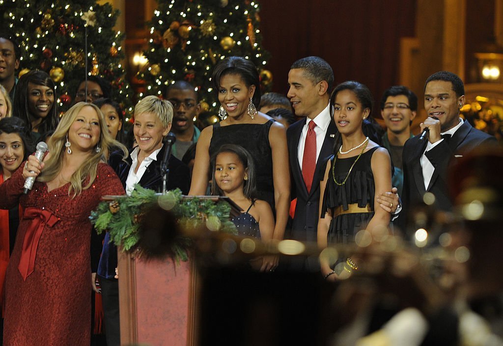 U.S. President Barack Obama and first lady Michelle Obama, with daughters Sasha and Malia, take part in the conclusion of a Christmas In Washington celebration | Getty Images