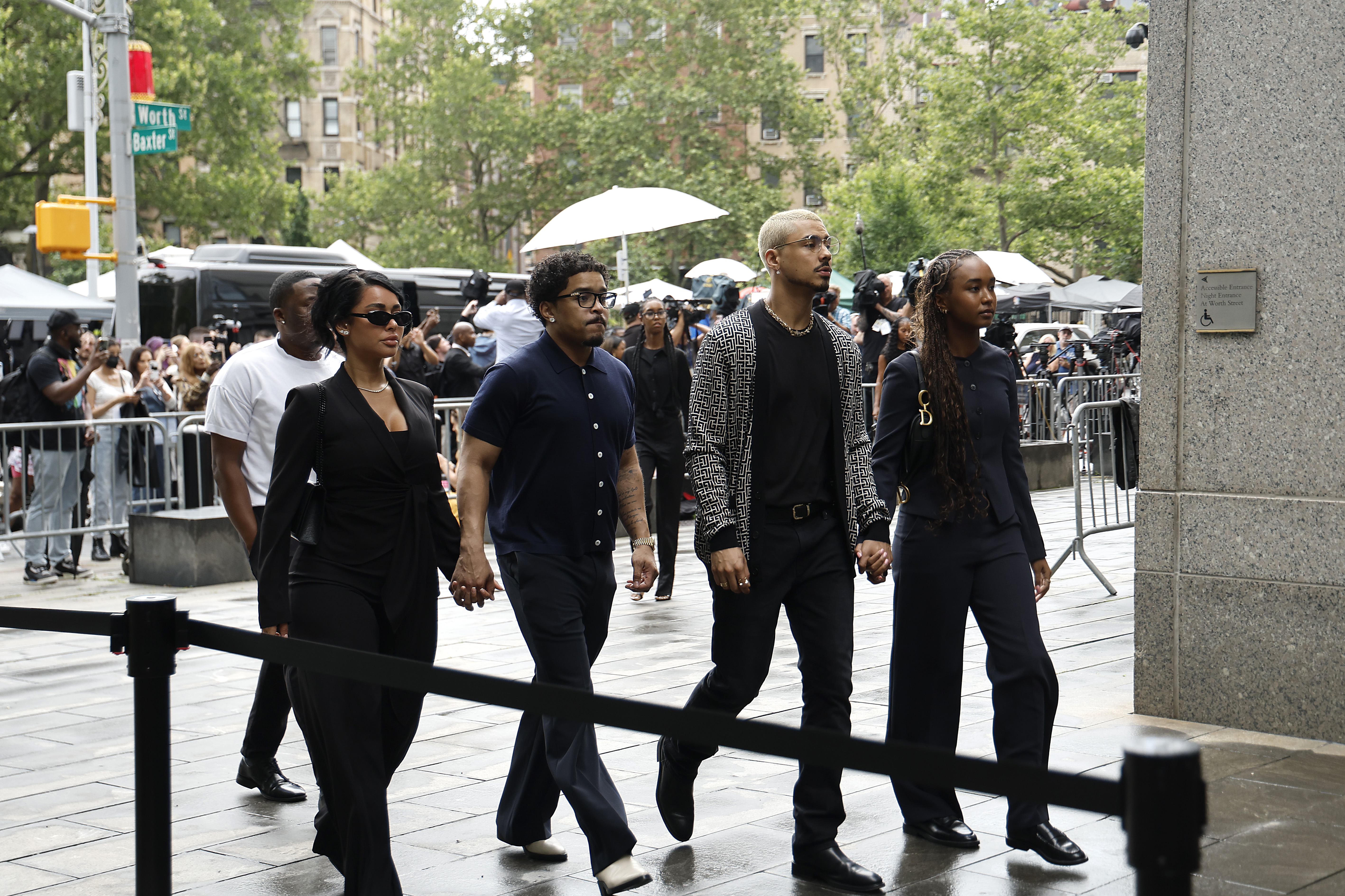 Stephanie Rao, Quincy Brown, Justin Combs, and Chance Combs arrive together in a unified front. Their expressions are focused and composed.