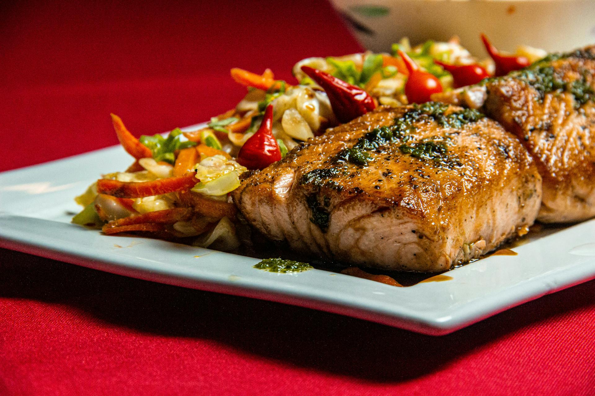 Grilled salmon on a white ceramic plate | Source: Pexels