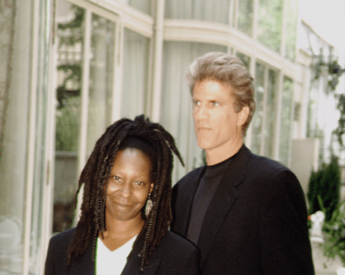 Whoopi Goldberg and co-star Ted Danson pose together donning all-black attires at the Ritz Hotel | Photo: Getty Images