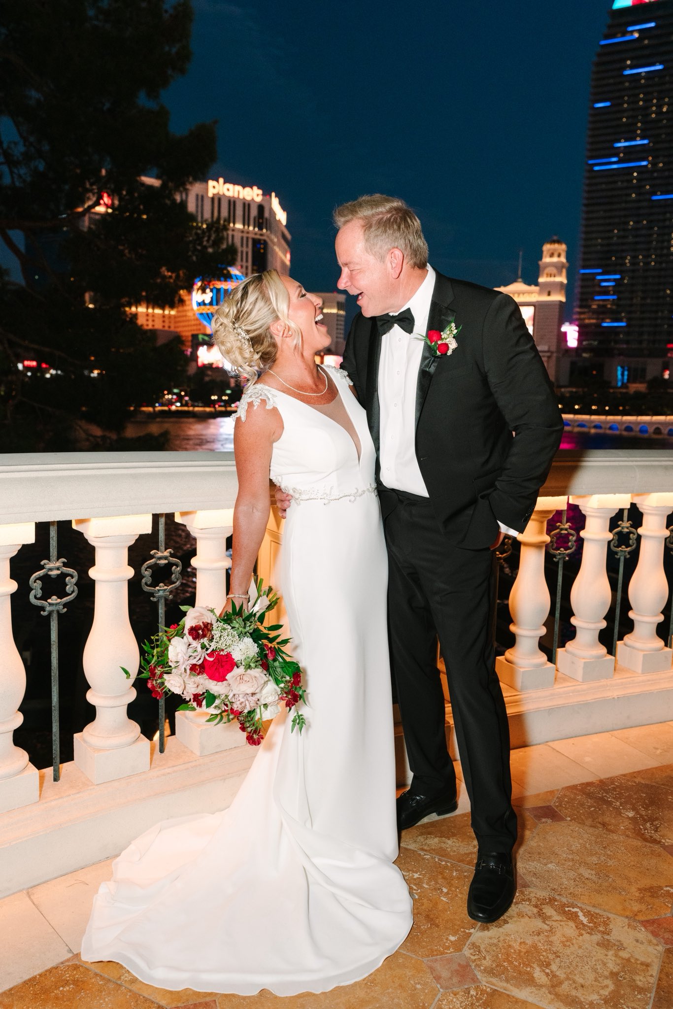 Greene was all smiles and laughter as she leaned in close to her new husband against the vibrant neon backdrop of the Strip. Clutched in her hand was a striking bouquet of roses that added a classic pop of color to her bridal look. | Source: X/mtgreenee