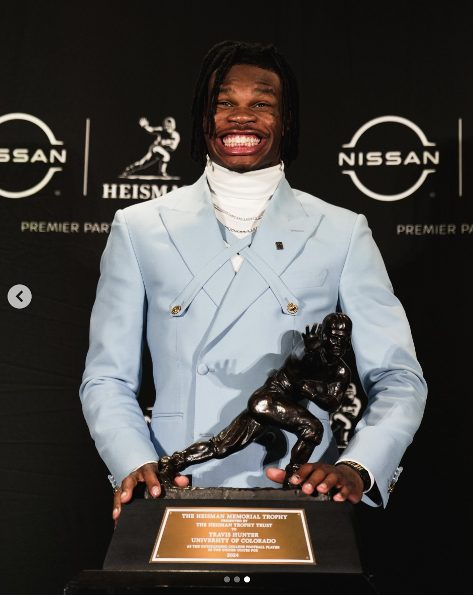 Travis Hunter holding his Heisman Trophy in a photo dated December 15, 2024 | Source: Instagram/db3_tip