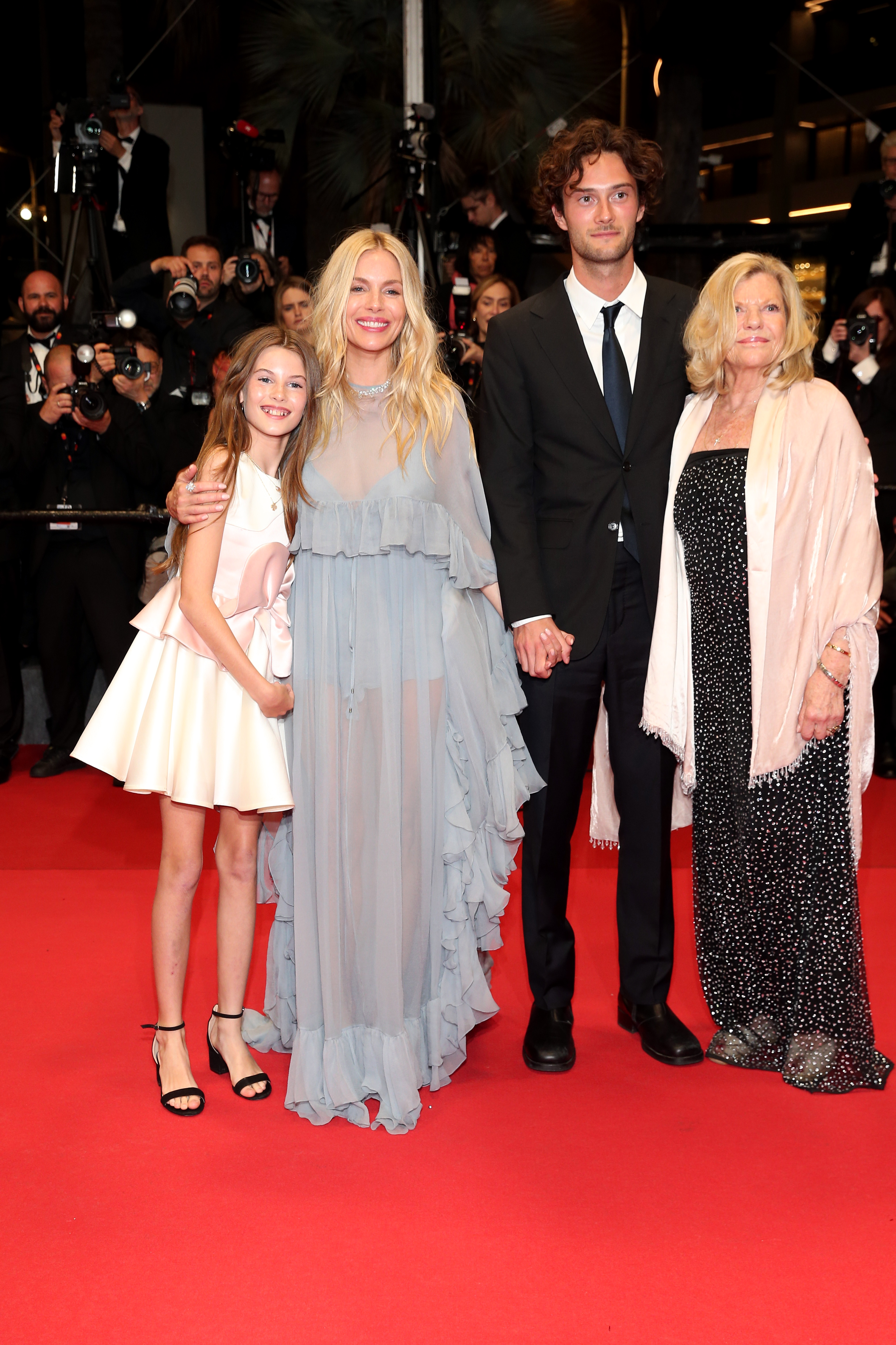 Sienna Miller and Oli Green with Marlowe Sturridge and Josephine Miller at the "Horizon: An American Saga" screening during the 77th Annual Cannes Film Festival in France on May 19, 2024. | Source: Getty Images