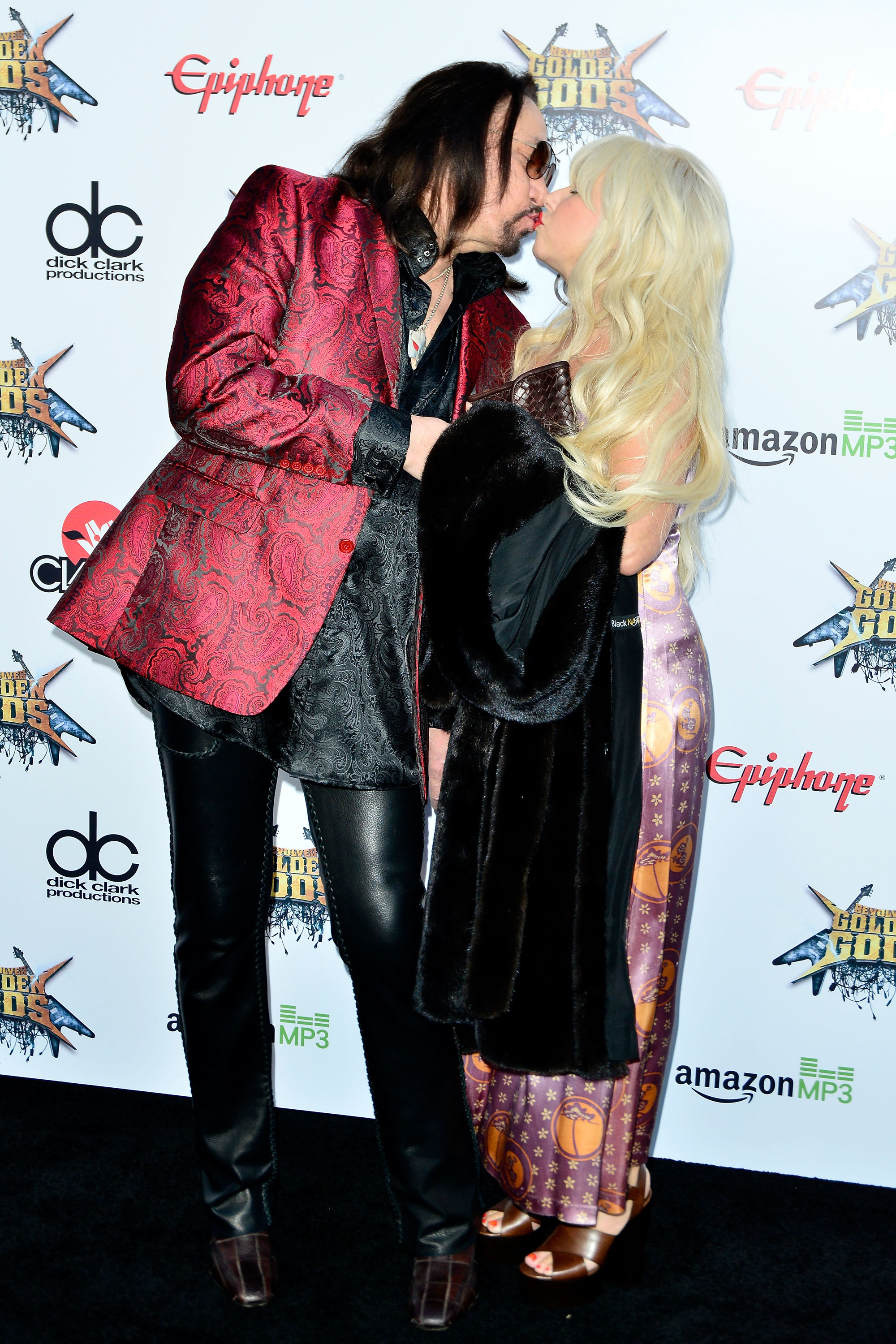 Ace Frehley and Jeanette Trerotola kiss at the Revolver Golden Gods Awards at Club Nokia on April 23, 2014 in Los Angeles, California | Source: Getty Images