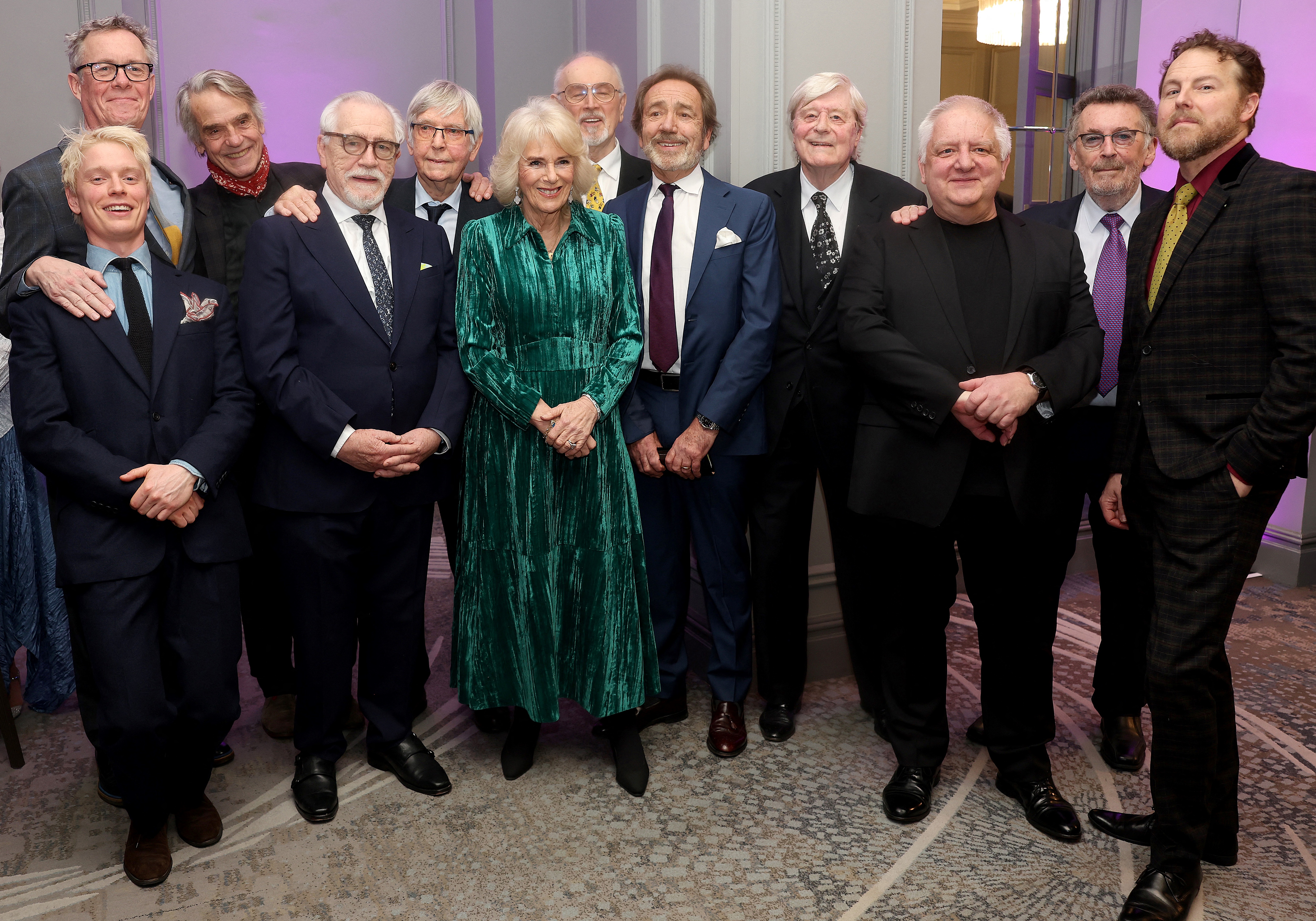 Britain's Queen Camilla, Alex Jennings, Freddie Fox, Jeremy Irons, Brian Cox, Tom Courtenay, Peter Egan, Robert Lindsay, Martin Jarvis, Simon Russell Beale, Robert Powell and Samuel West, 2024 | Source: Getty Images