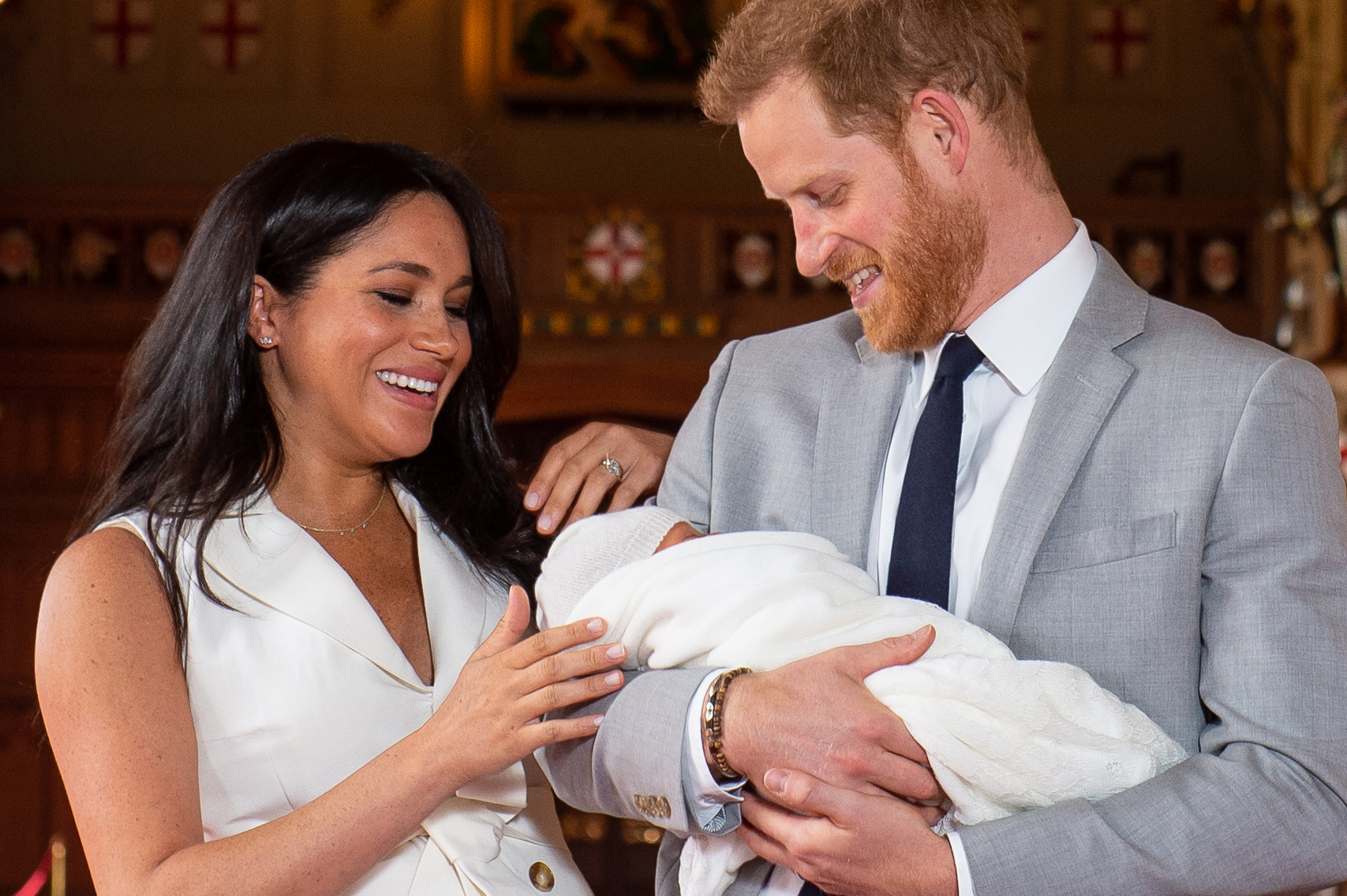 Meghan Markle and Prince Harry holding their son, Archie Mountbatten-Windsor, in St George's Hall at Windsor Castle on May 8, 2019 in Windsor, England. | Source: Getty Images