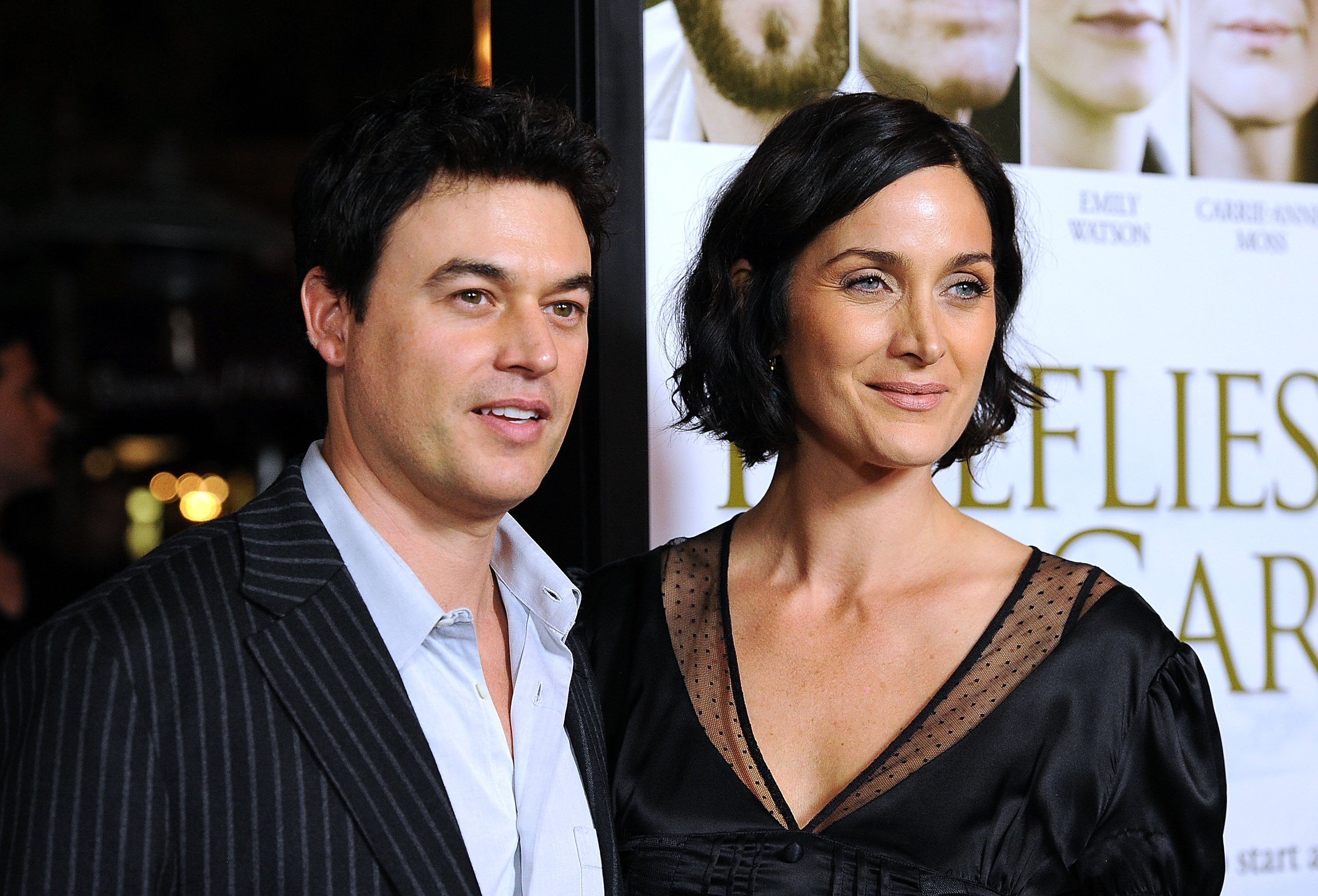 Steven Roy and Carrie-Anne Moss arrive at the premiere of "Fireflies In The Garden" at the Pacific Theaters at the Grove on October 12, 2011 in Los Angeles, California ┃Source: Getty Images